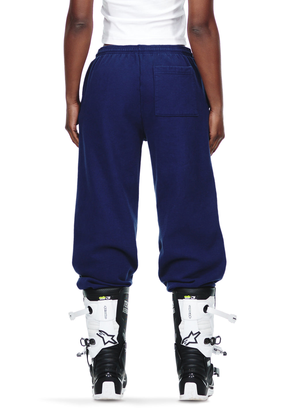 Navy OG WEB SWEATPANT, 23oz fleece, with puff and discharge print, worn by a model from behind.