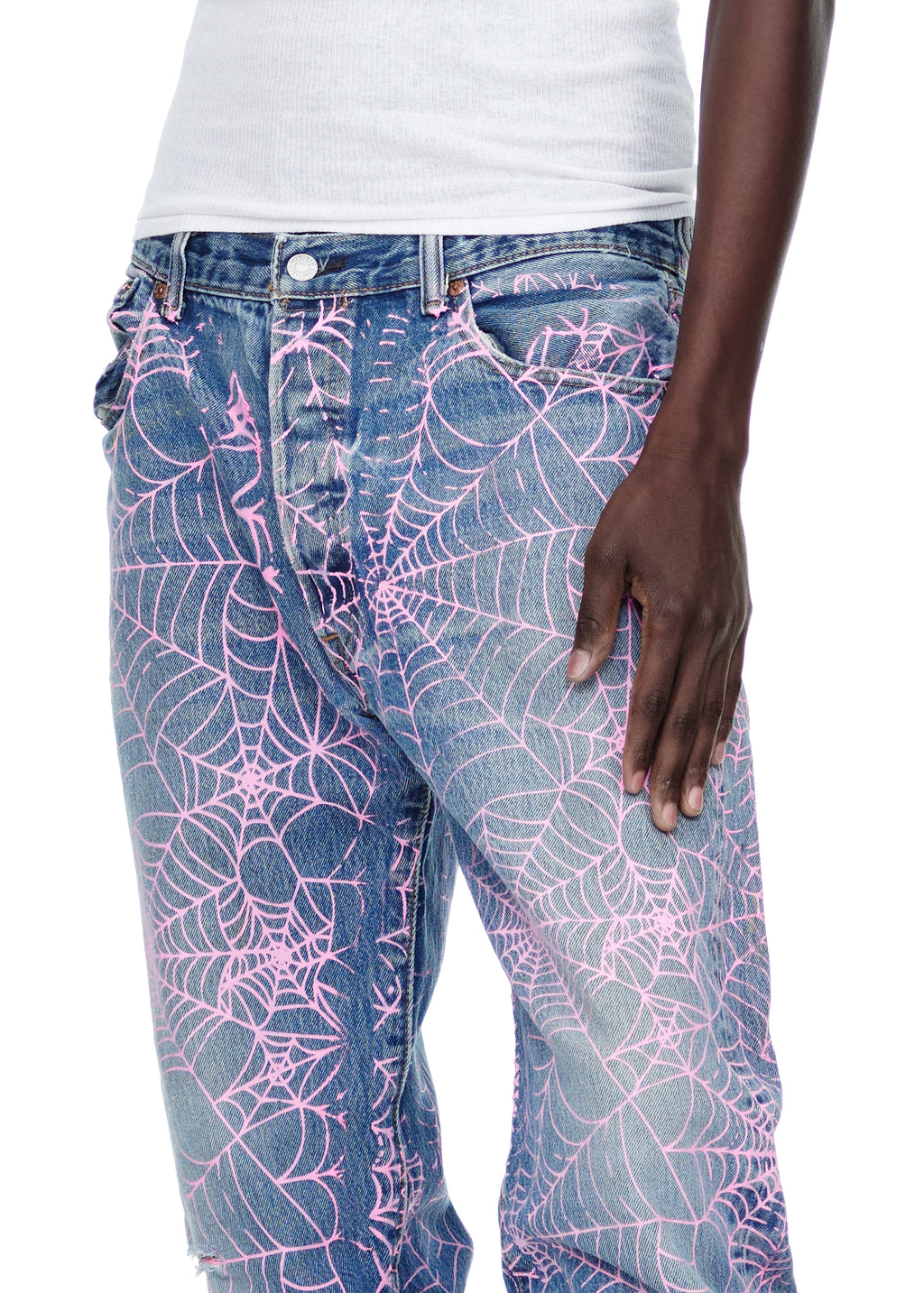 Vintage Levi's 501 denim jeans with all-over pink web print and distressed details.