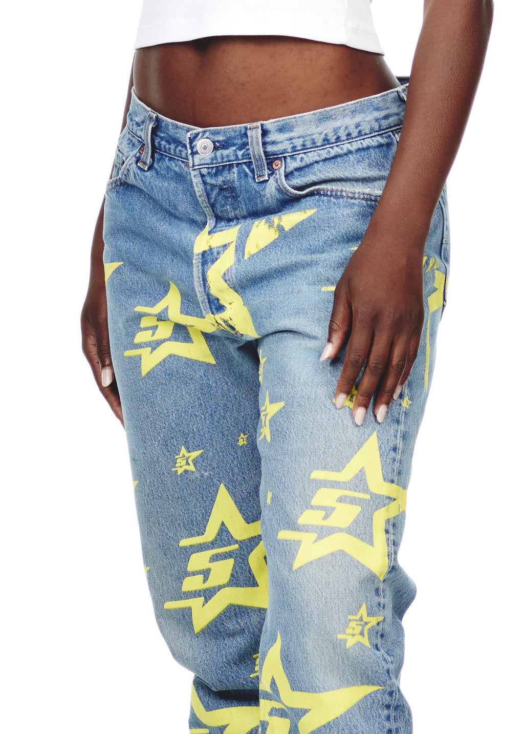 Vintage Levi's 501 denim jeans with yellow 5STAR print and a leather SP5DER back tab.