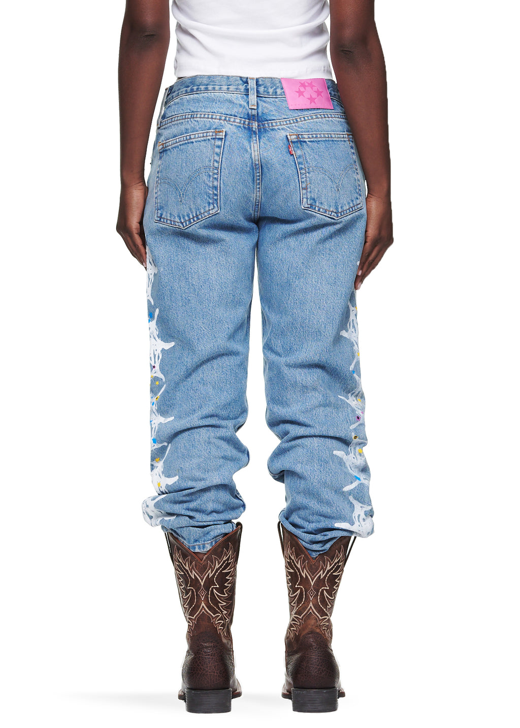 Vintage Levi's 501 denim jeans with a pink SP5DER leather back tab and white contrast web design down the legs.