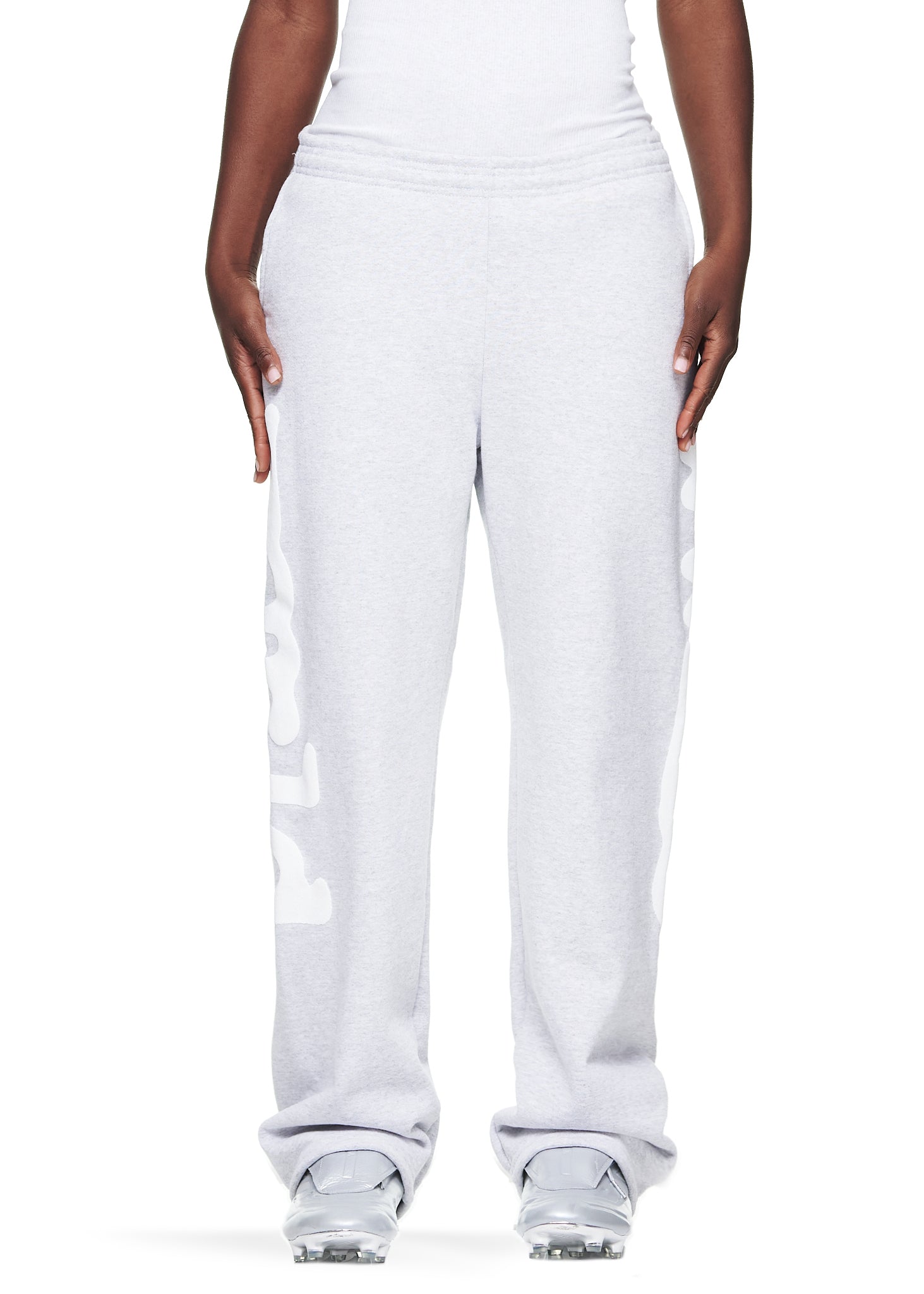 Women's light grey straight leg fleece sweatpants with "Worldwide" puff print down both legs.