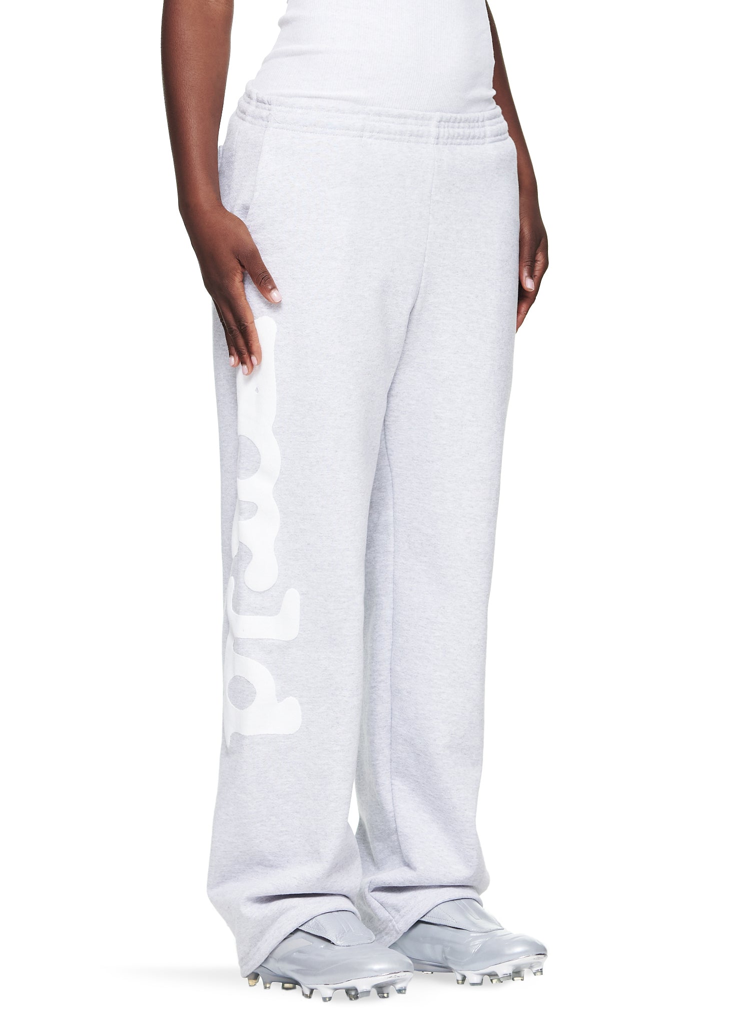 Women's light grey straight leg fleece sweatpants with "Worldwide" puff print down the left leg.