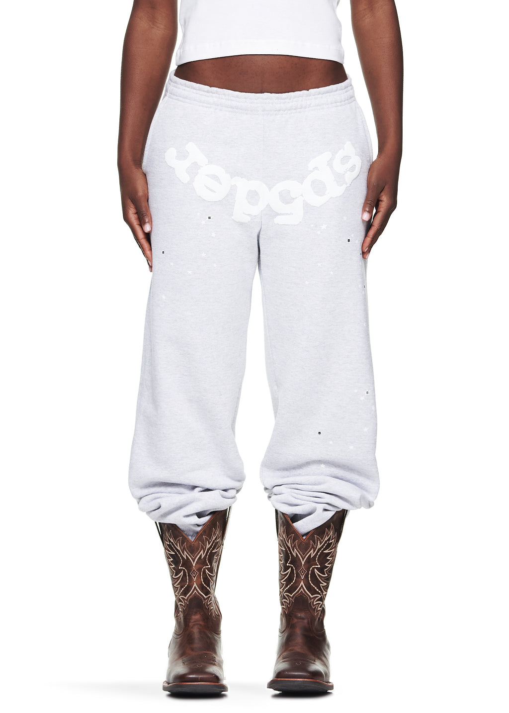 Heather Grey OG Web Sweatpants with white puff print "Sp5der" text, scattered stars, and brown cowboy boots.