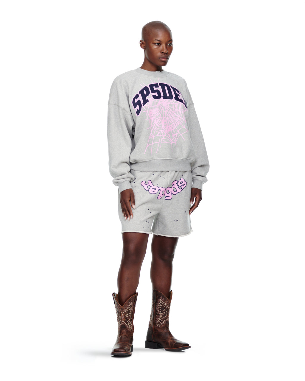 Gray VARSITY WEB CREWNECK with purple "SPSDE" and pink spider web print, worn by a model.