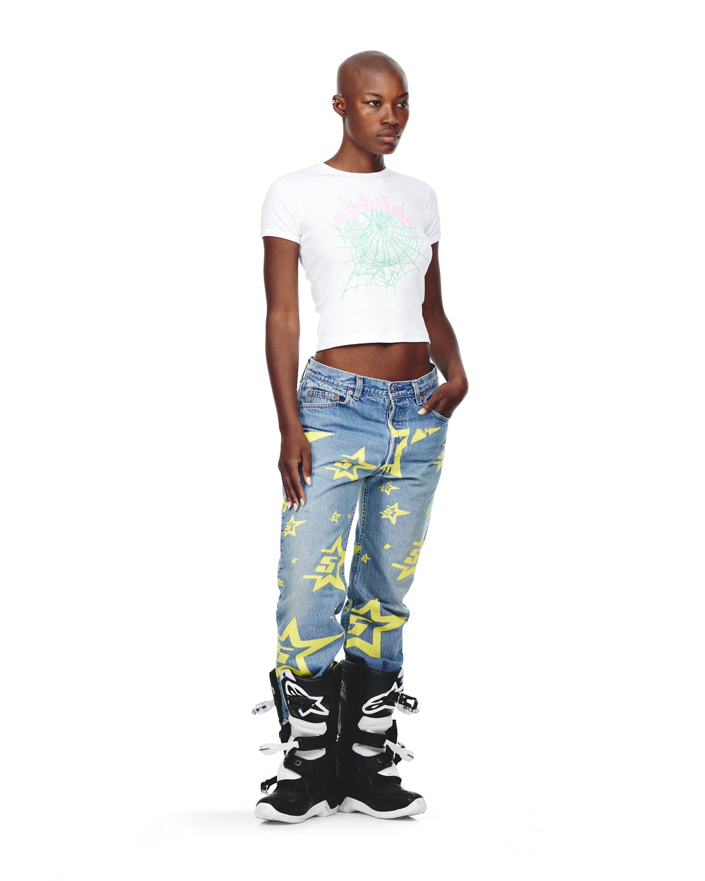 Female model in vintage Levi's 501 denim with yellow 5STAR print, white crop top, and black boots.