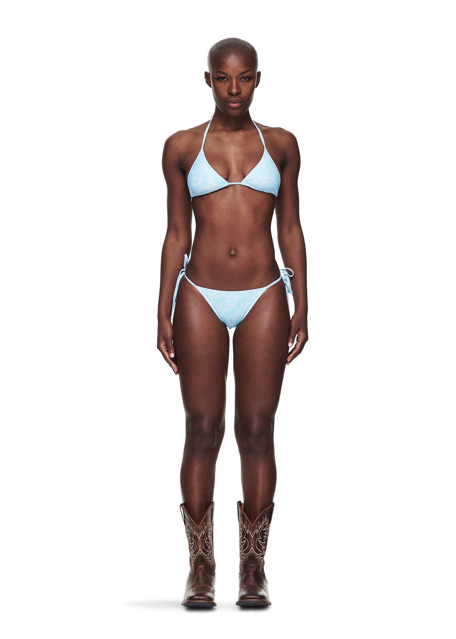 Blue Five Star bikini set with rope ties, worn by a model in cowboy boots.