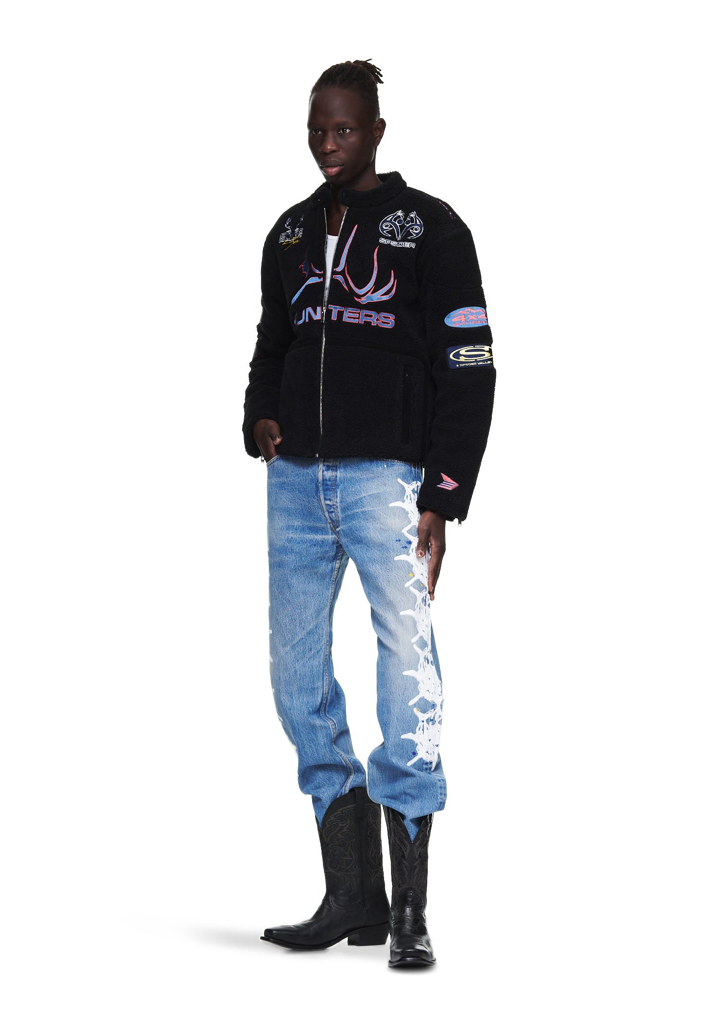 Black sherpa moto jacket with custom SP5DER patches, embroidery, leather trim, and zip closure.
