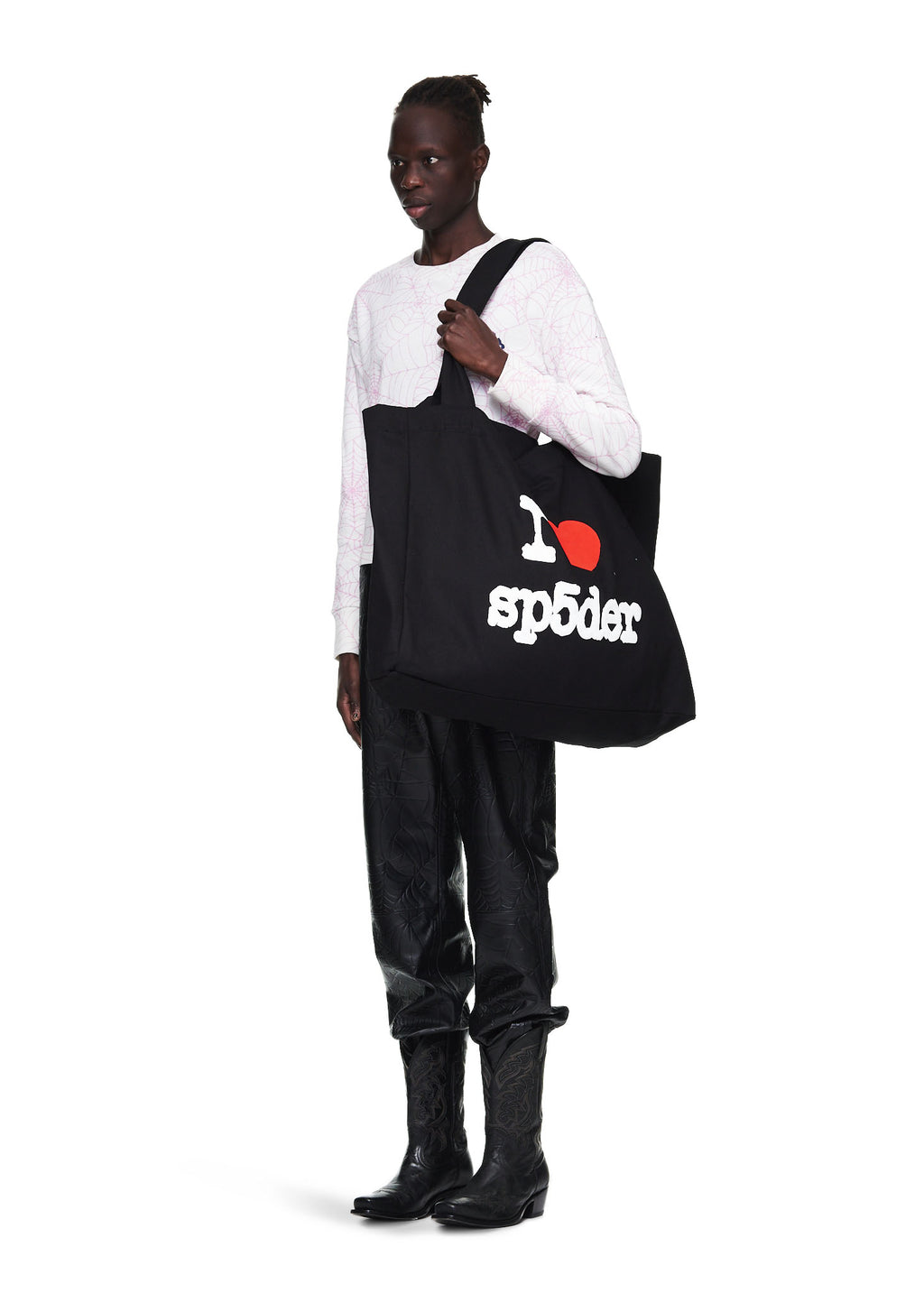 Black Souvenir XL Tote with "I ♥︎ SP5DER" jumbo print, worn by a model.