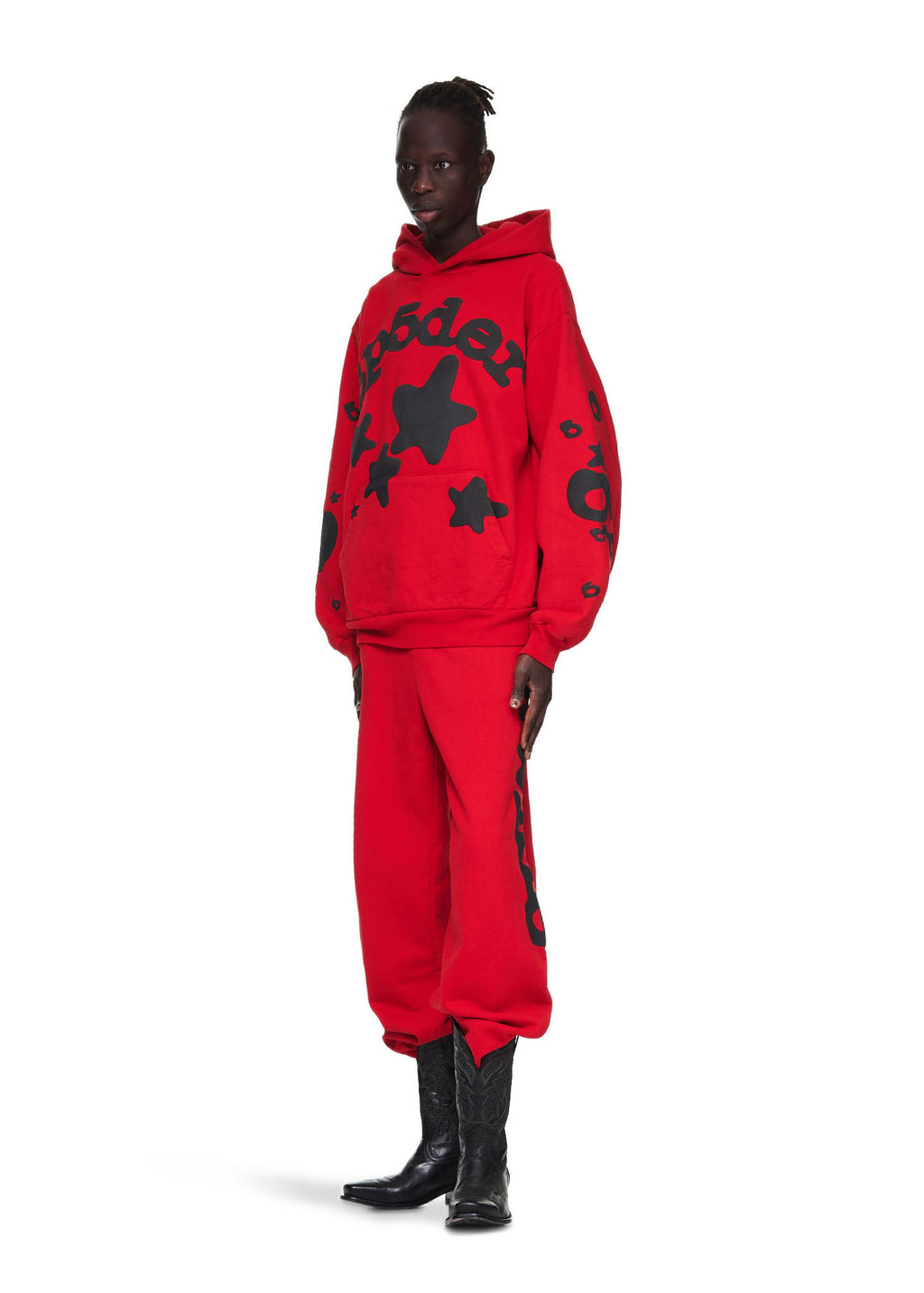 Male model in red Beluga hoodie and sweatpants with black 'SP5DER' and star puff print.