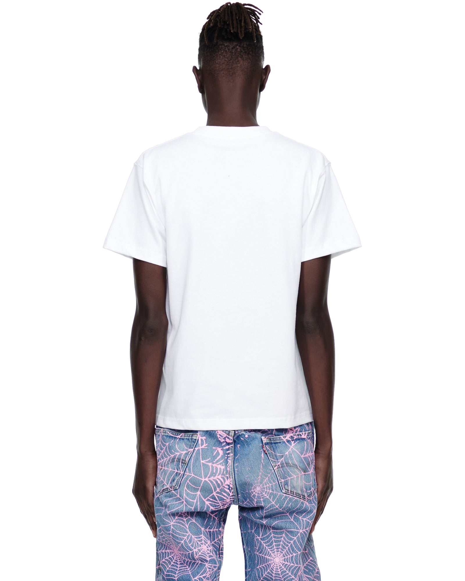 Back view of a male model wearing a white 100% cotton standard fit tee.