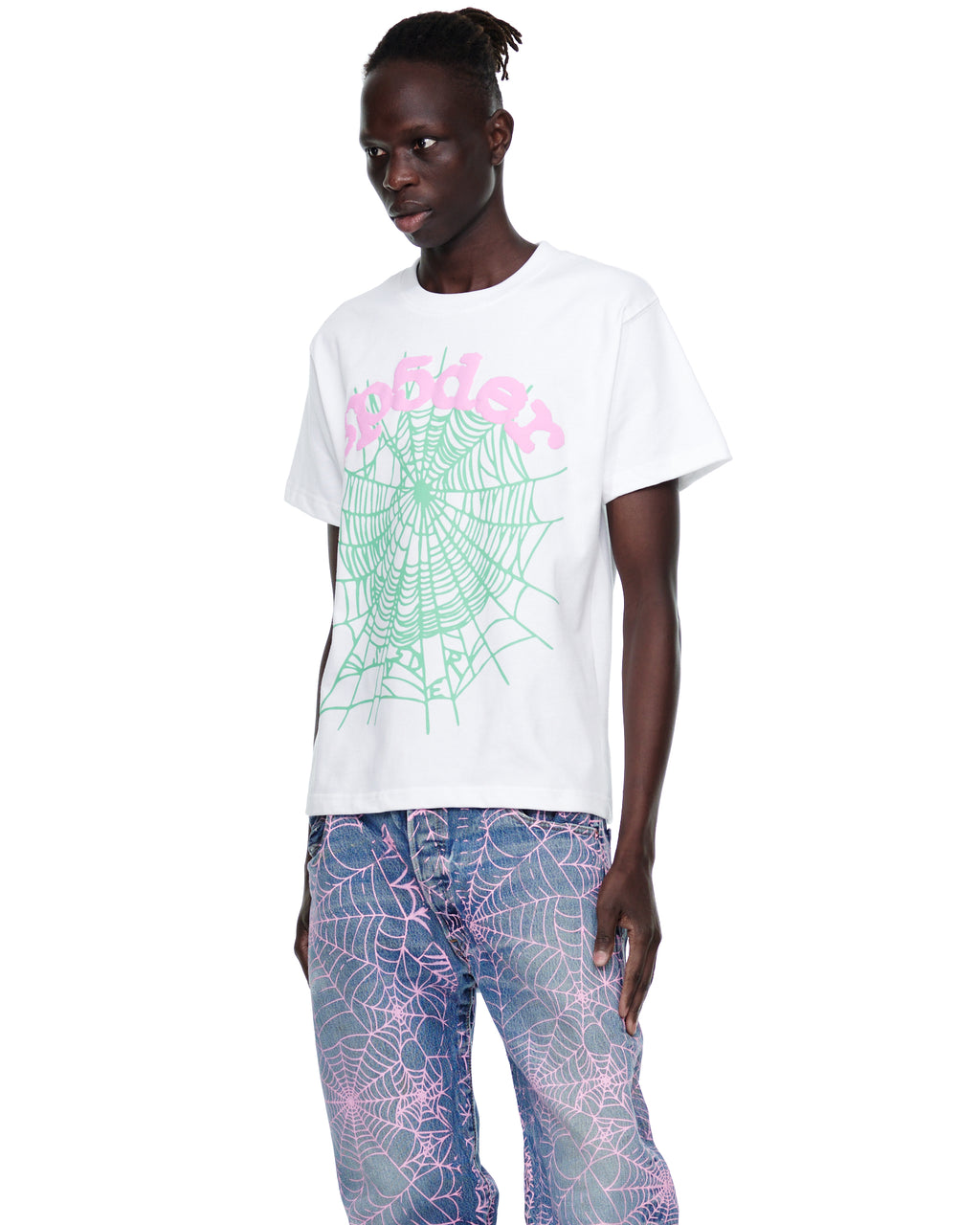 Male model in white 100% cotton OG WEB CANDY TEE with green spiderweb and pink "sp5der" print.