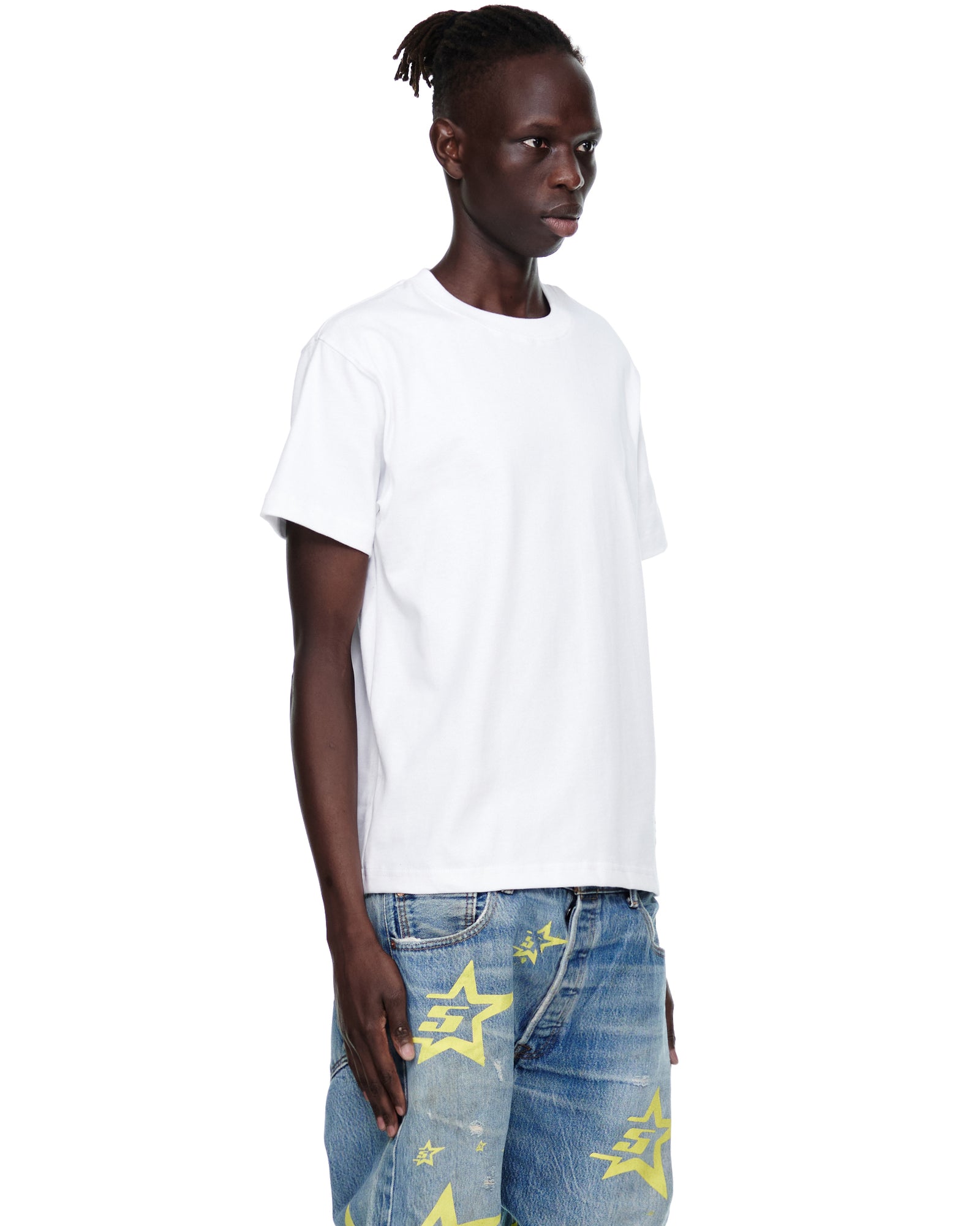 Male model wearing a white 100% cotton 5STAR UTILITY TEE with an oversized fit.