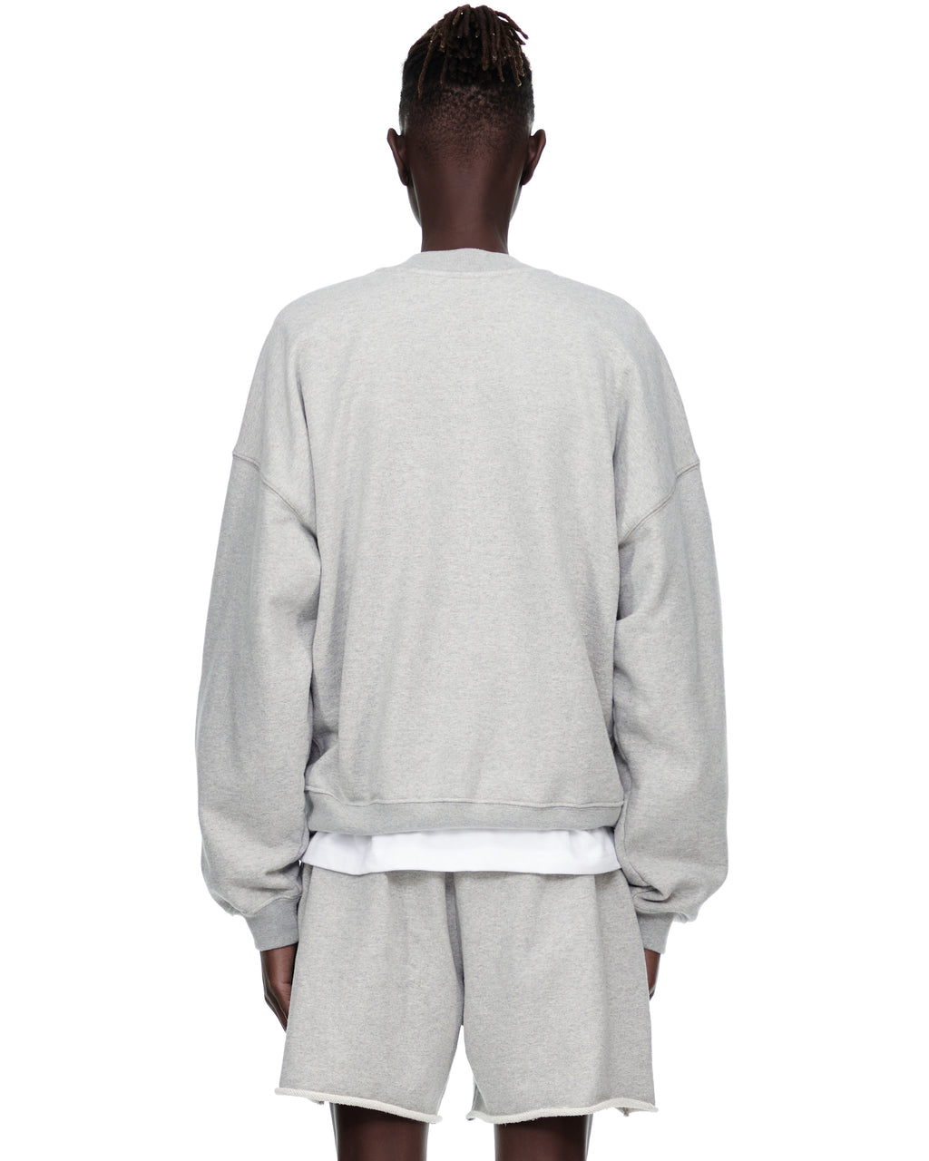 Grey VARSITY WEB CREWNECK sweatshirt and matching shorts on a model, back view.