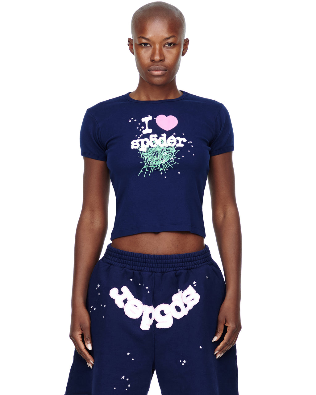 Female model in navy cropped cotton baby tee with "I heart sp5der" graphic and matching sweatpants.