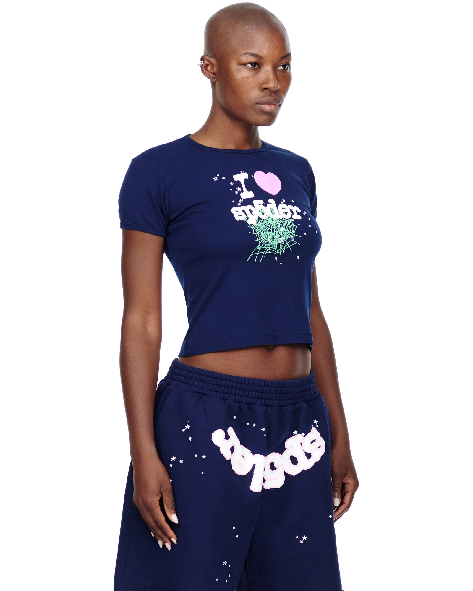 Female model in a navy blue cropped cotton baby tee with "I ❤️ spider" graphic print.