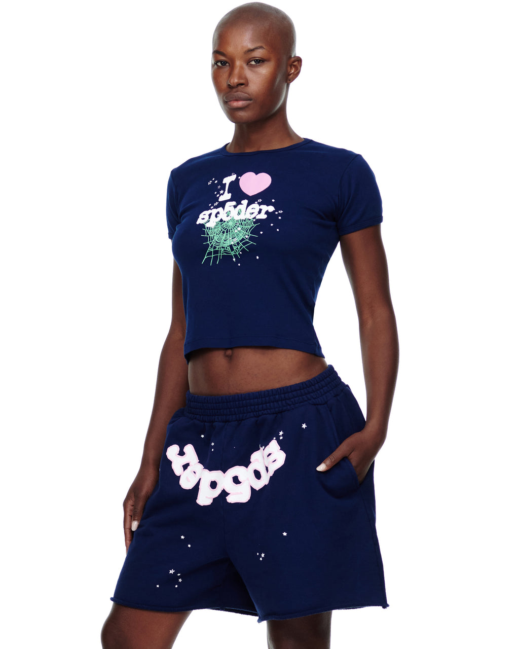 Female model in navy cotton cropped baby tee with "I heart spider" graphic.