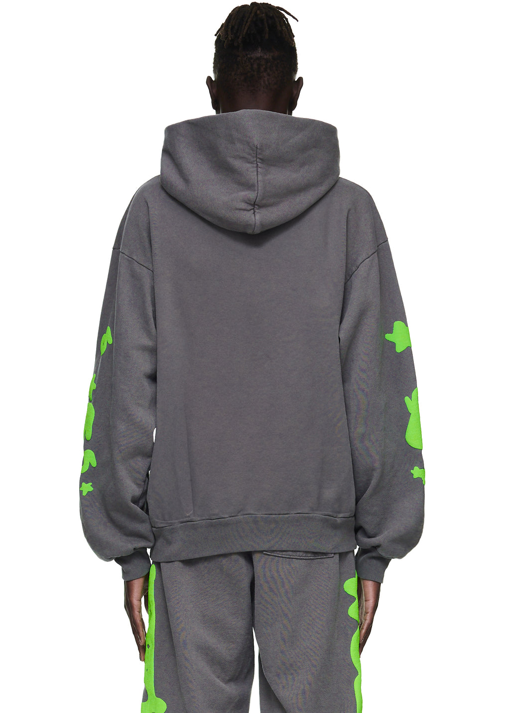 Back view of a male model wearing a slate grey Beluga hoodie and matching sweatpants with neon green puff print.