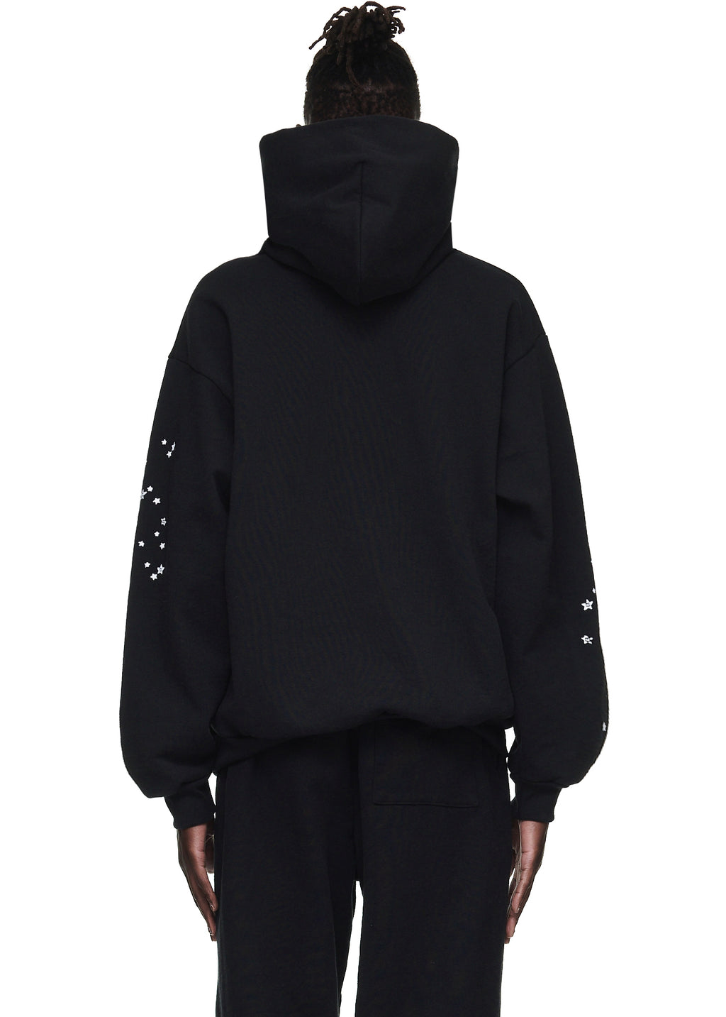 Black OG WEB HOODIE, 23oz fleece, with white star print on sleeves, worn by a model.