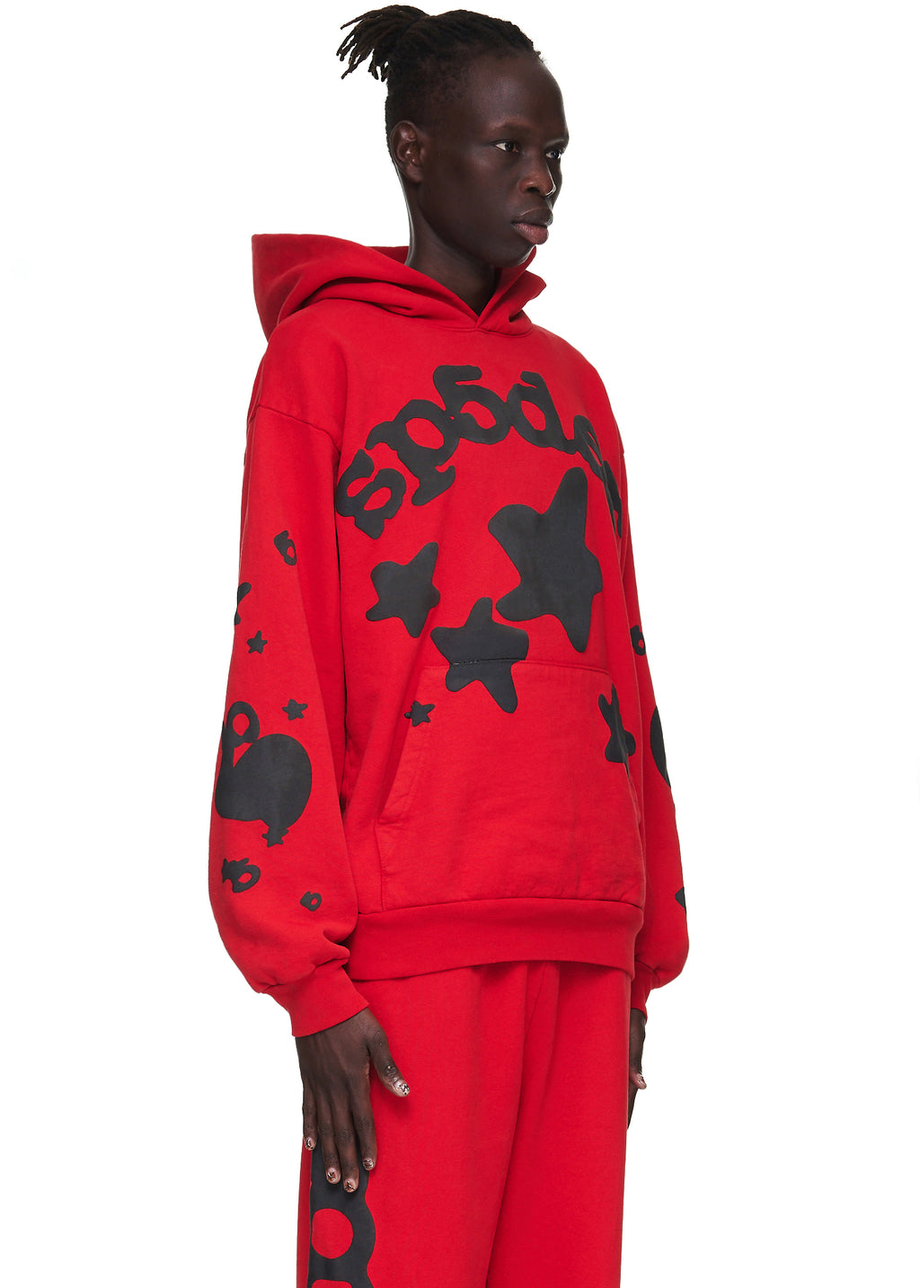 Red Beluga Hoodie with black puff print "SP5DER" and star designs, worn by a male model.