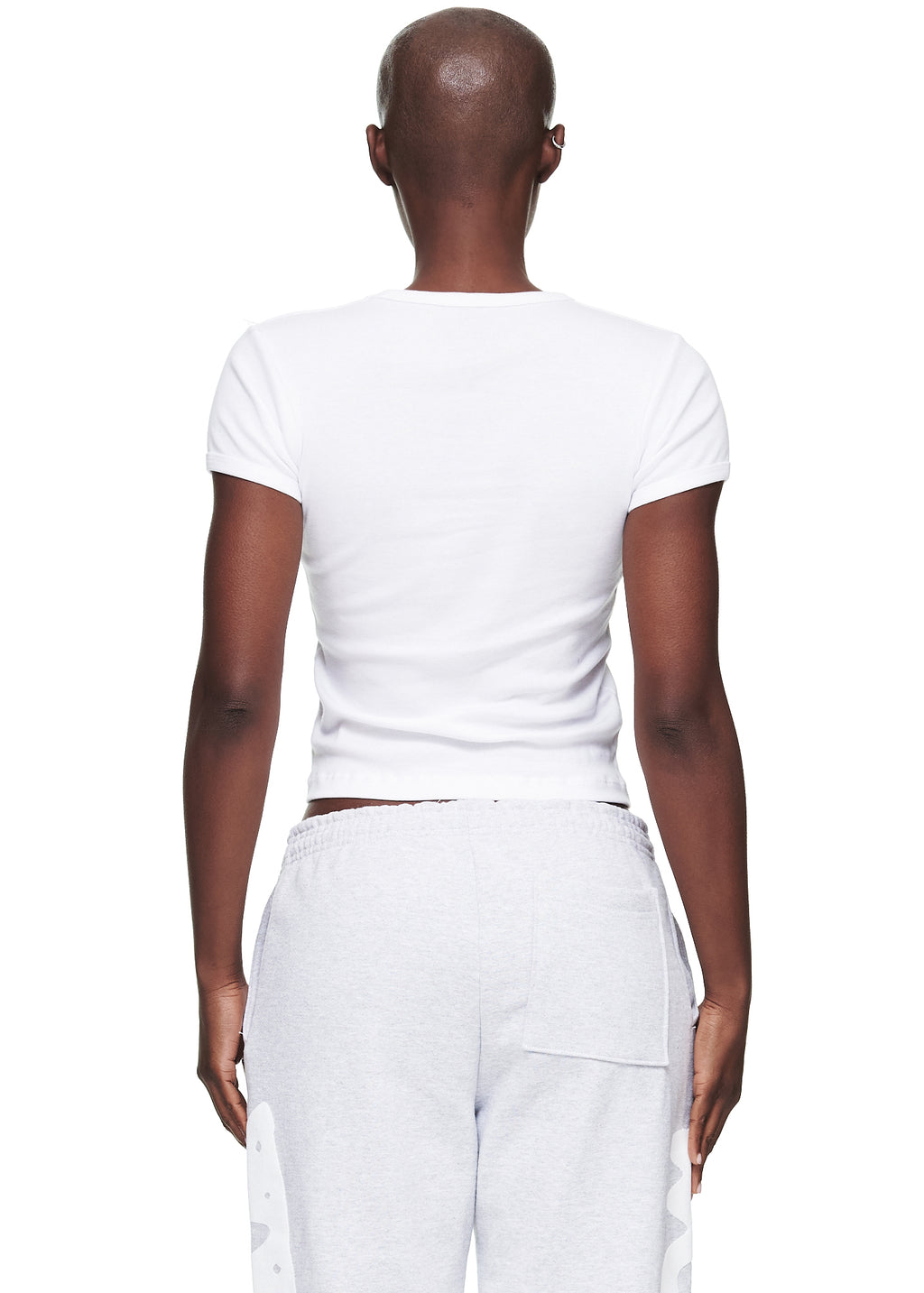 Back view of a female model wearing a plain white cropped fitted cotton baby tee.