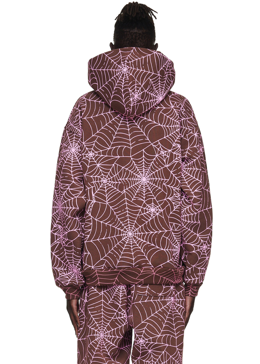 Brown fleece hoodie with all-over cracked pink spider web print, worn by a male model.