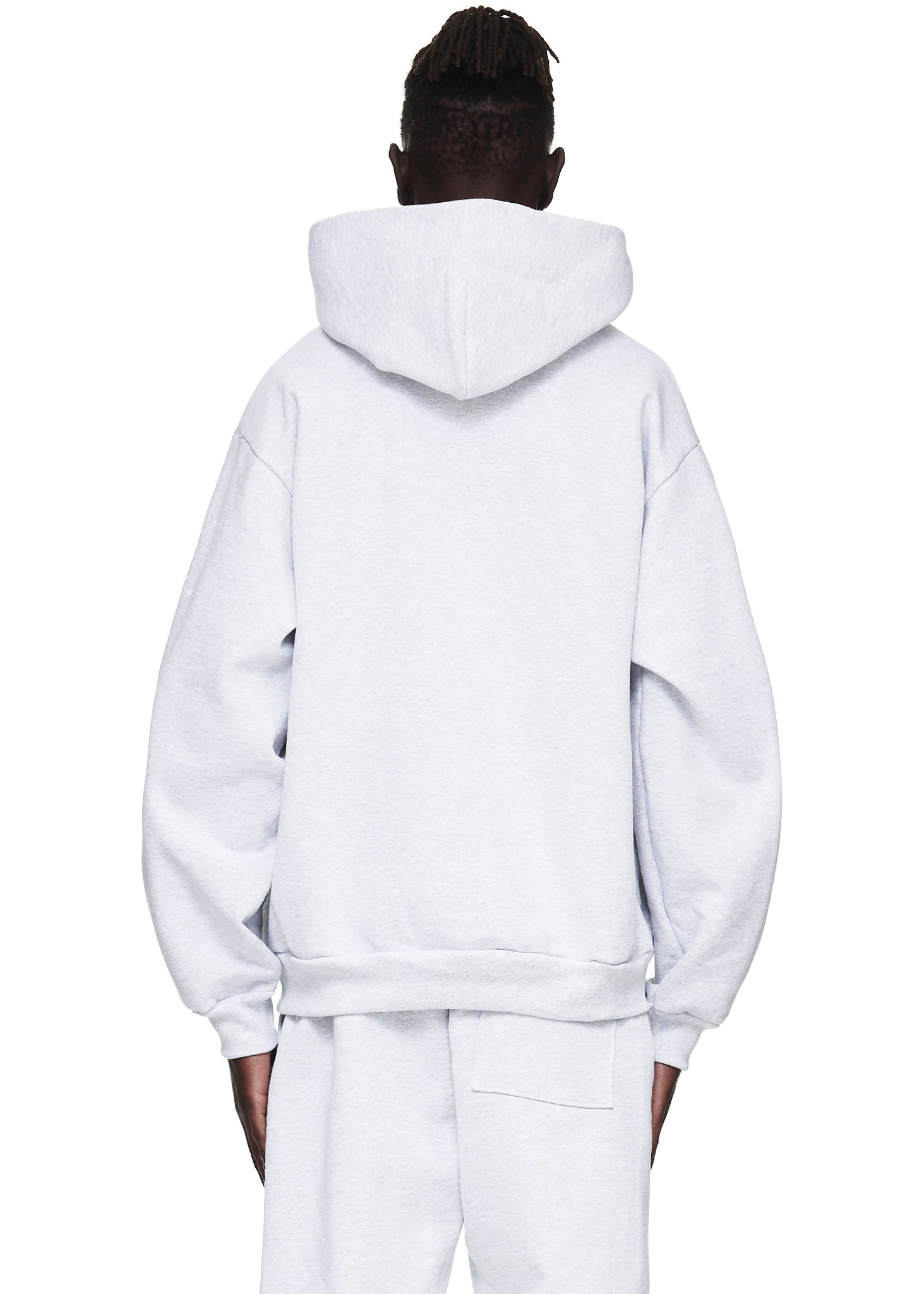 Back view of a male model wearing a heather grey 23oz fleece OG WEB HOODIE.