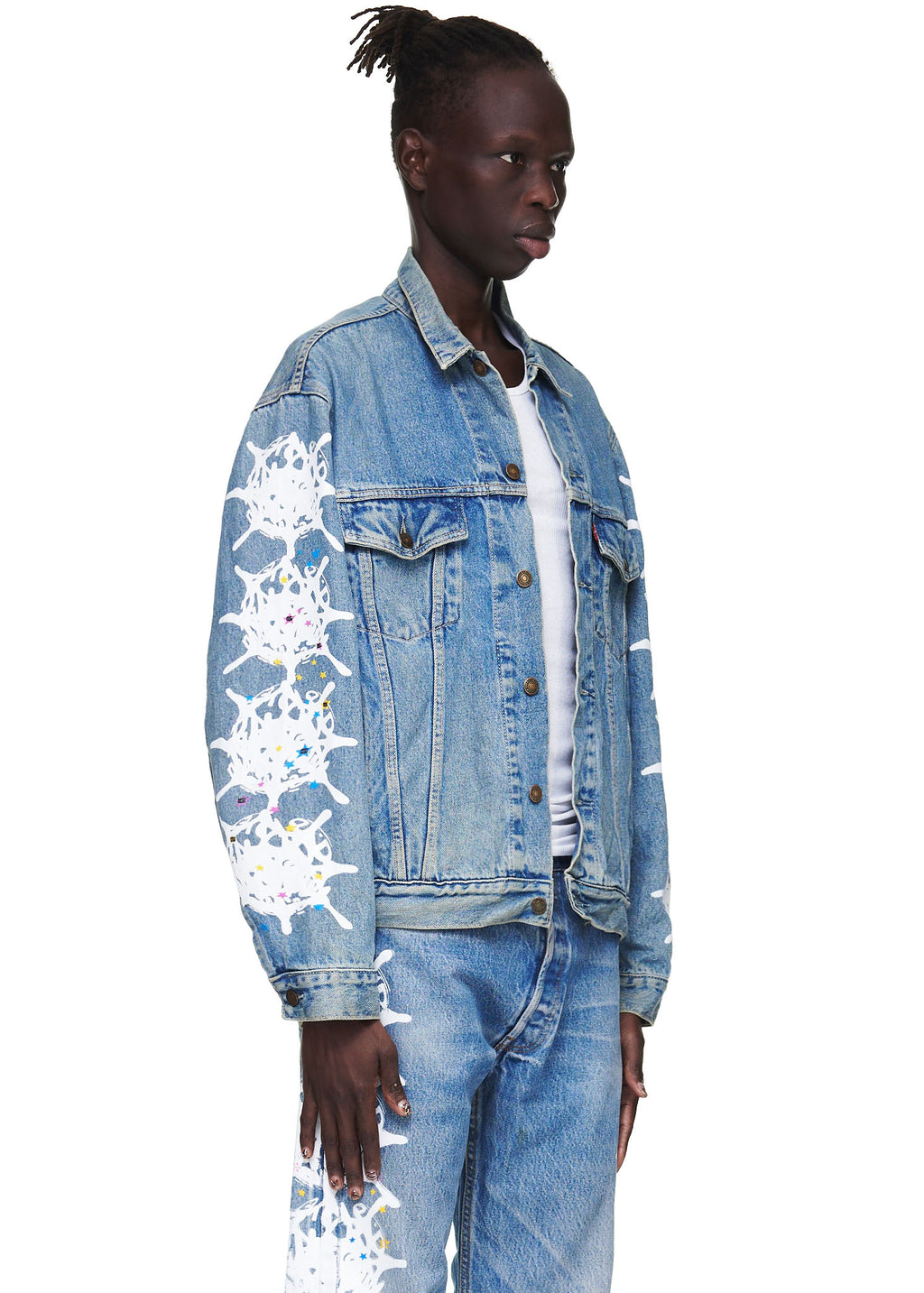 Vintage Levi's denim trucker jacket with white contrast web down both arms and silver buttons.