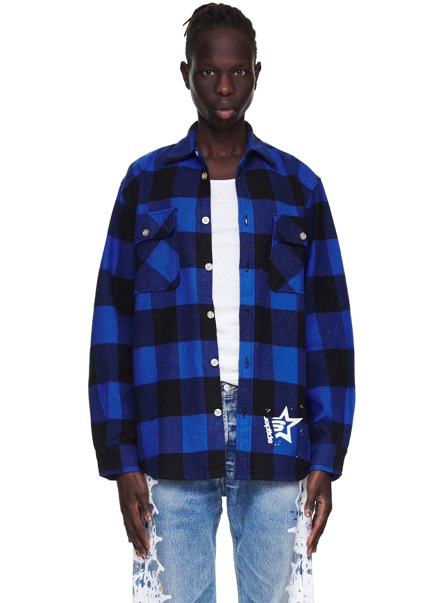 Male model in blue and black plaid flannel shirt with "5" graphic, spread collar, and chest pockets.