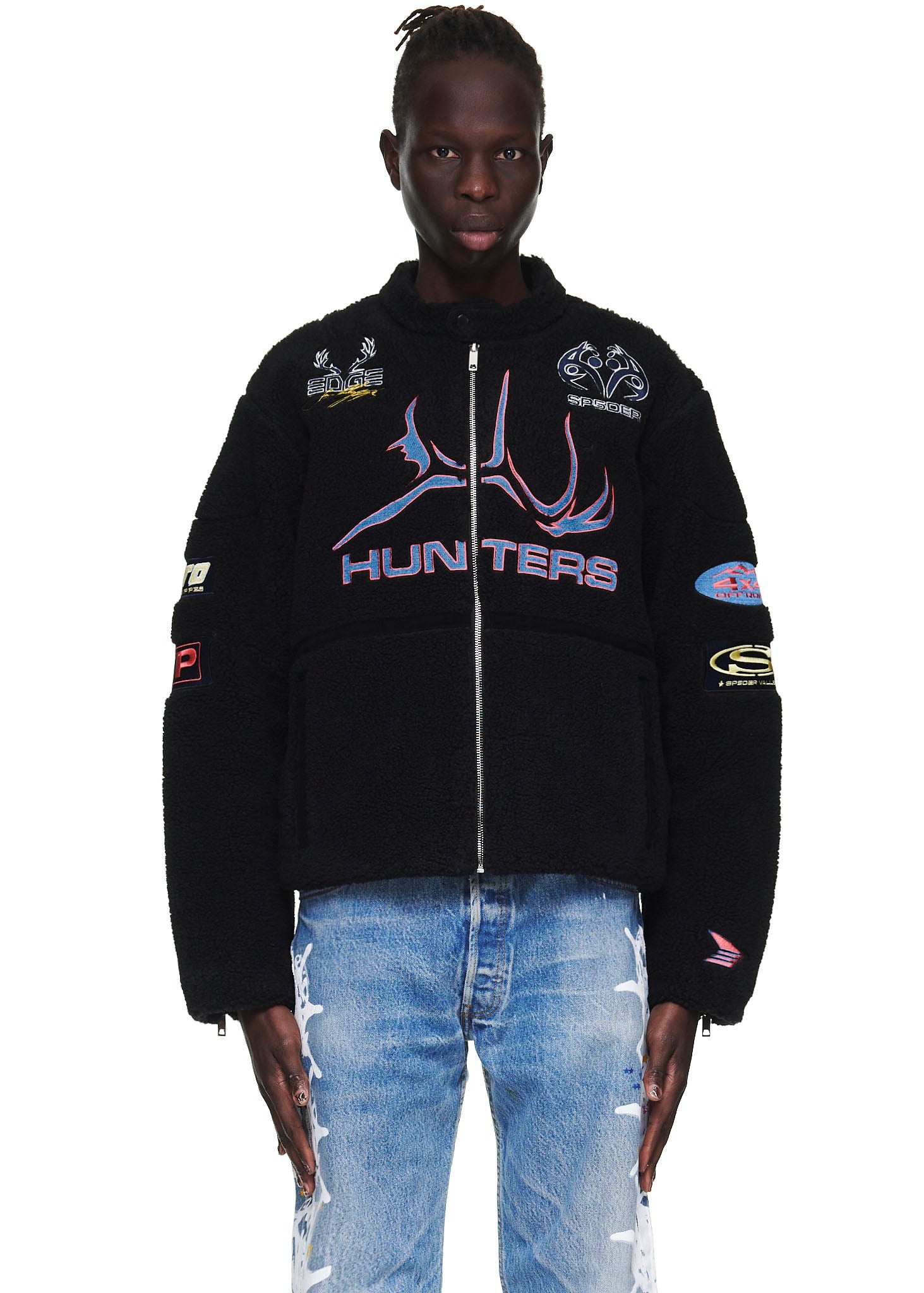 Black sherpa Hunter Moto jacket with custom SP5DER patches, embroidery, zip closure, and welt pockets.