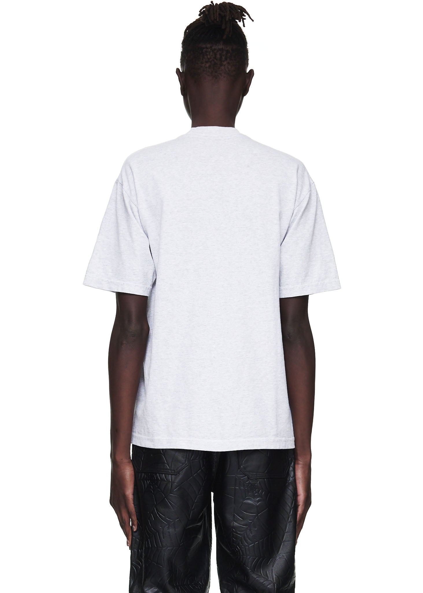 Back view of a male model wearing a standard fit heather grey 100% cotton utility tee.