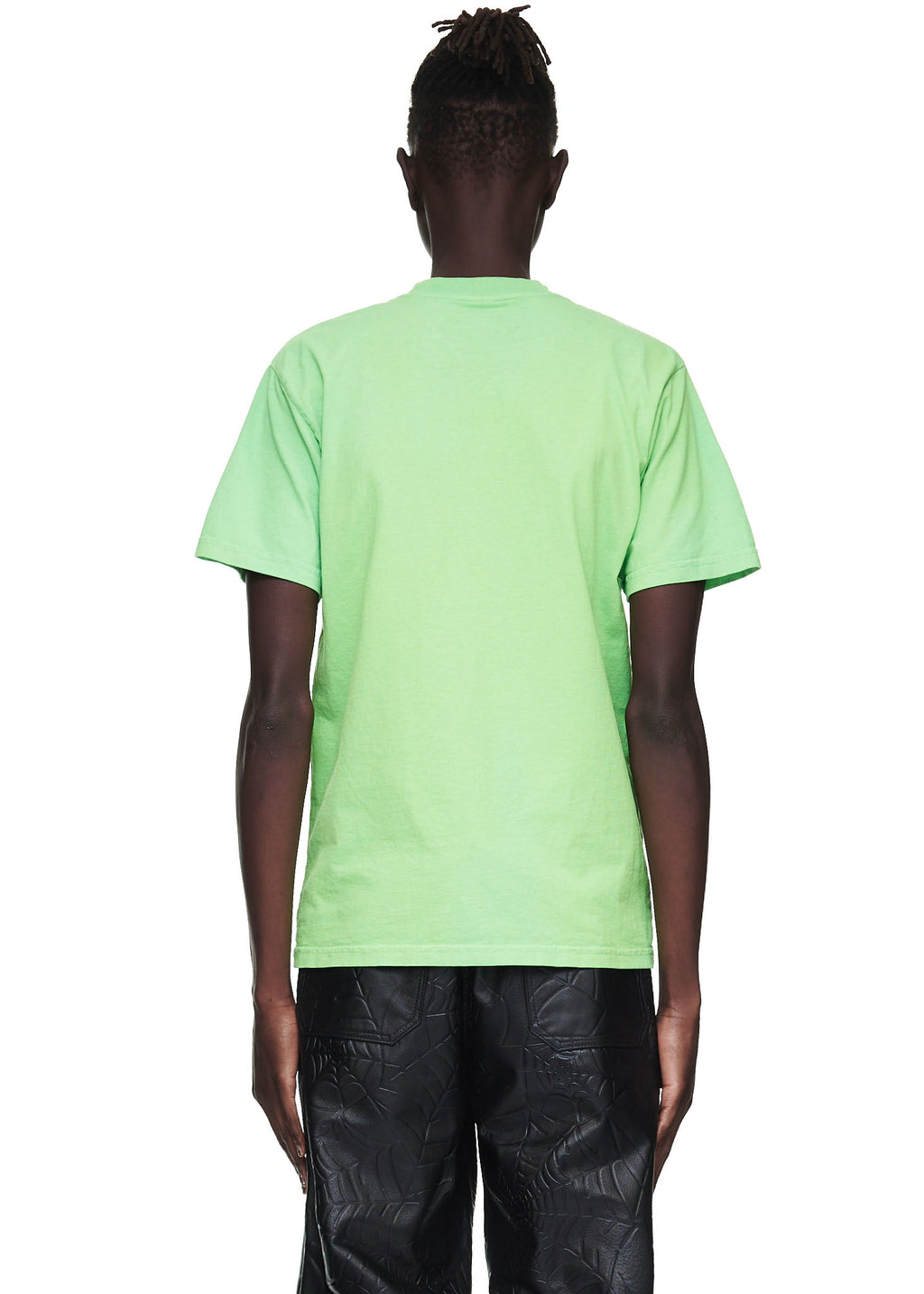 Back view of a male model wearing a plain slime green 100% cotton standard fit tee.