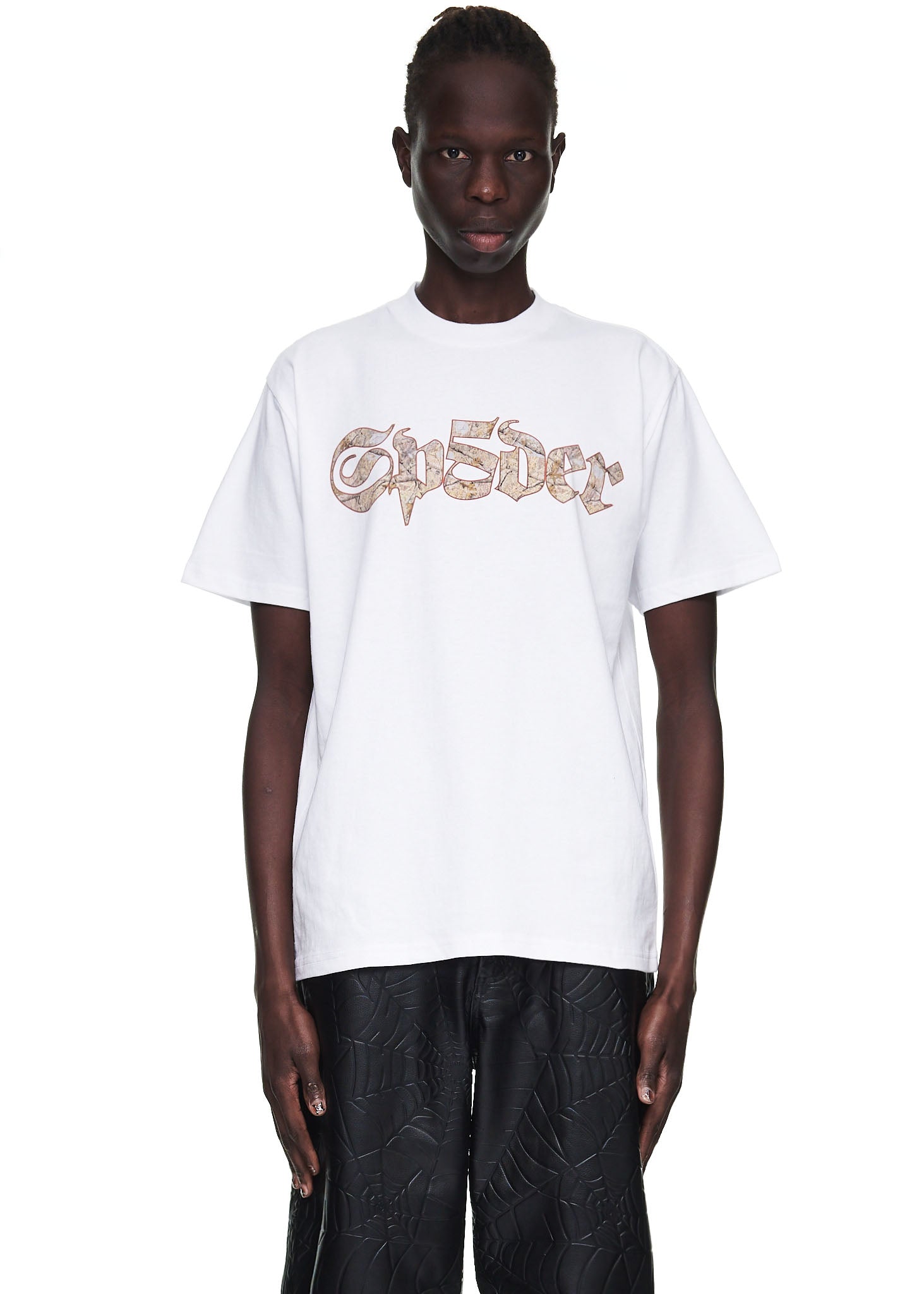 Male model in white 100% cotton tee with "Sp5der" graphic print on front.
