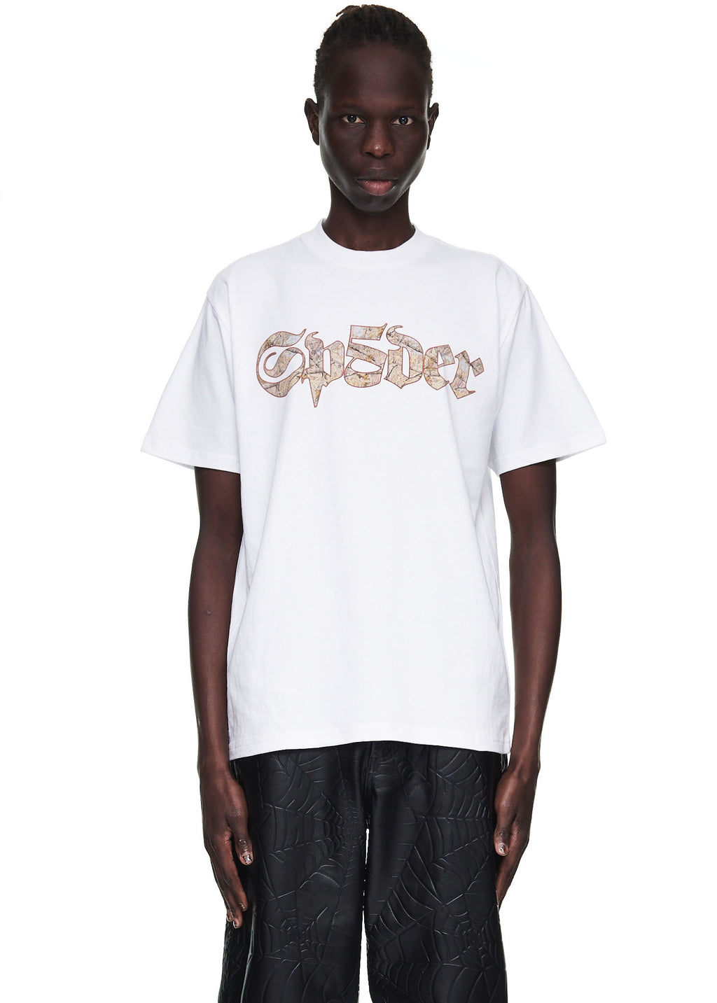 Male model in white 100% cotton tee with "Sp5der" graphic print on front.