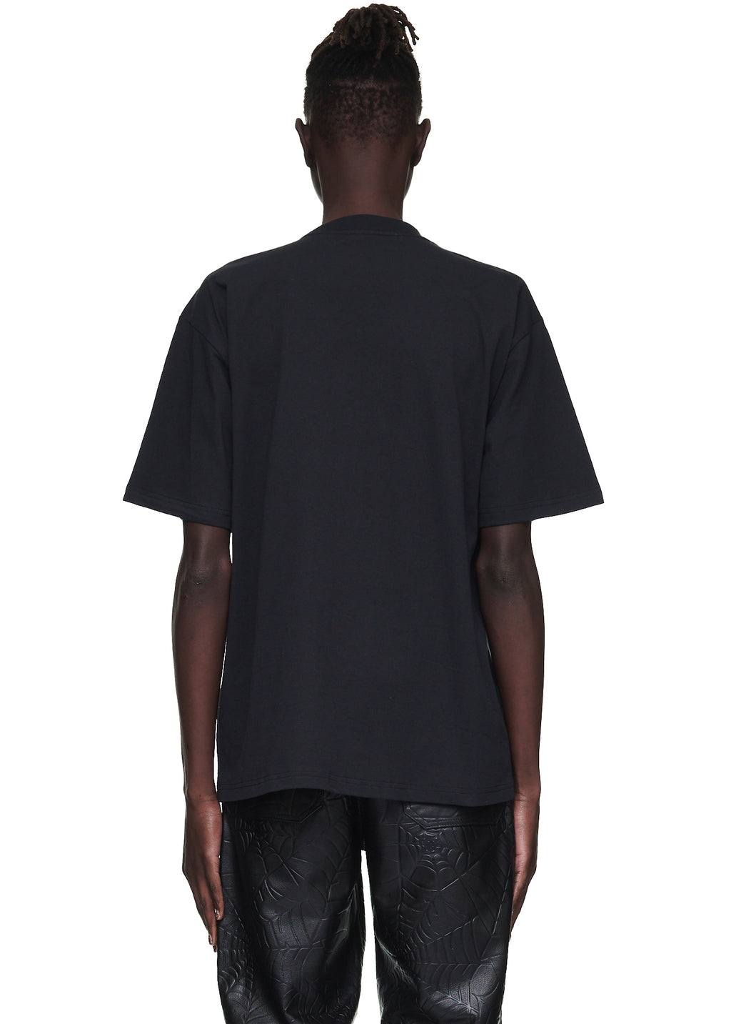 Back view of a male model wearing a plain black 100% cotton standard fit tee.