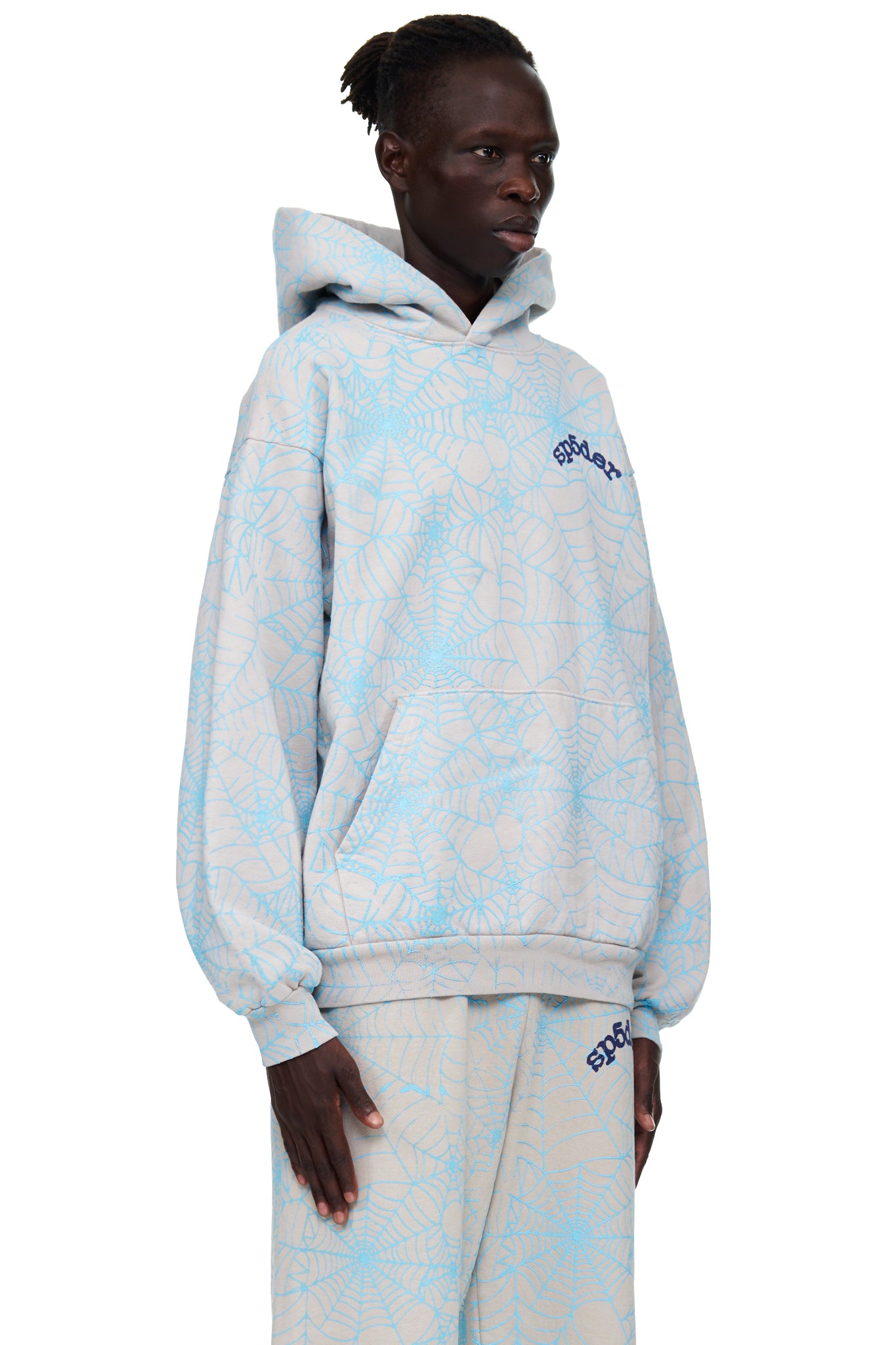 Light grey AOP WEB HOODIE with all-over cracked blue spiderweb print and "SP5DER" text.