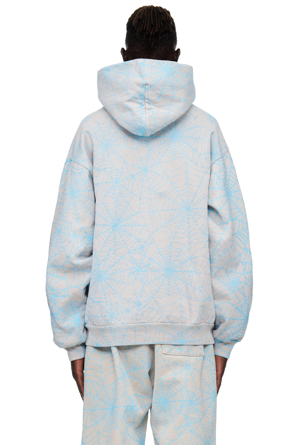 Back view of a light grey AOP WEB HOODIE with an all-over cracked blue spider web print.