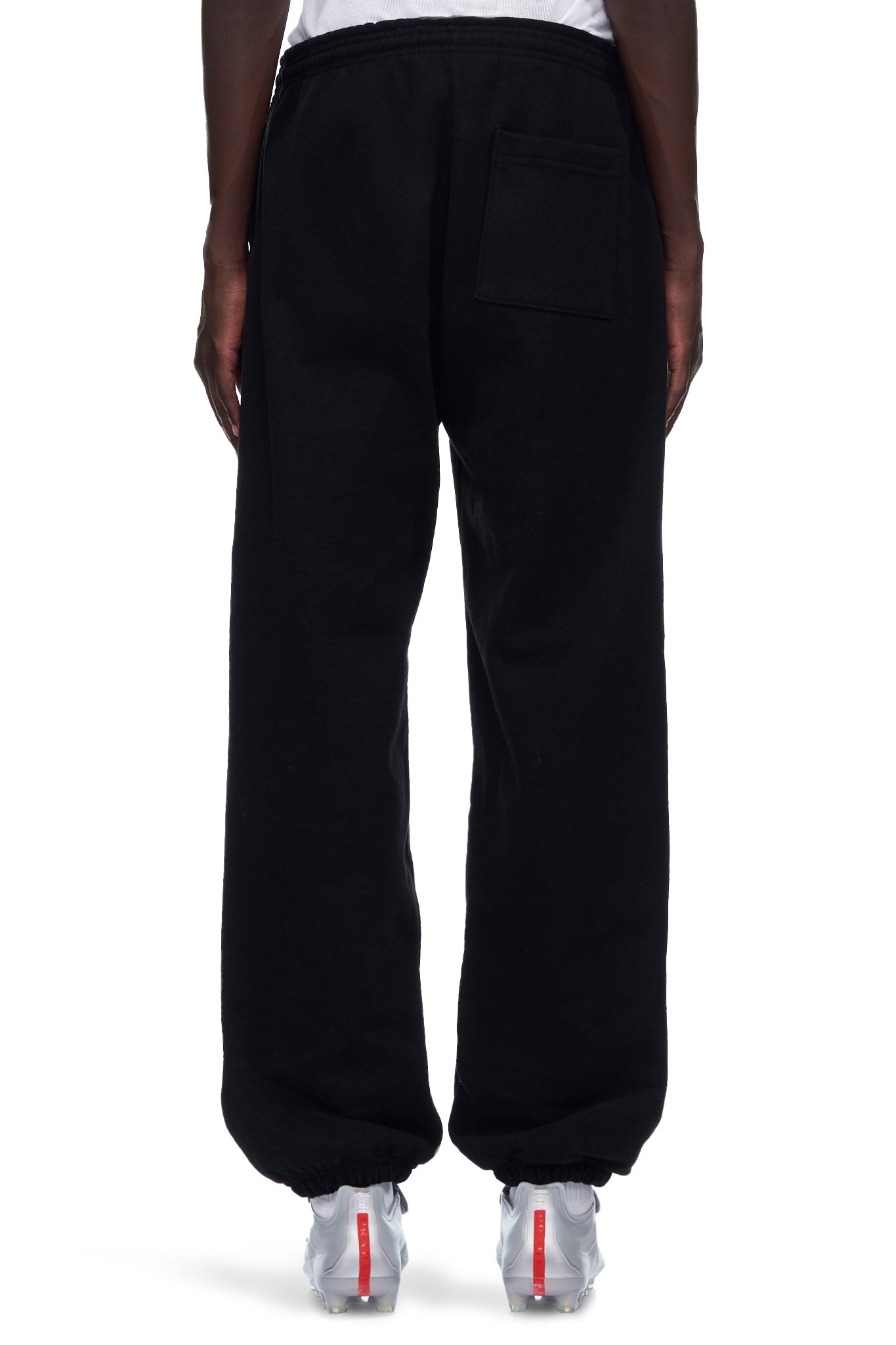 Black fleece souvenir sweatpants with a back pocket and elastic cuffs.