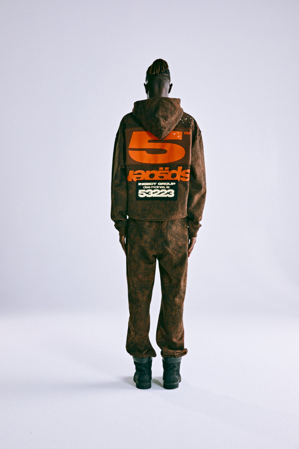 Brown tree camo hoodie and sweatpants set with large orange '5' and 'SP5DER' text on back.
