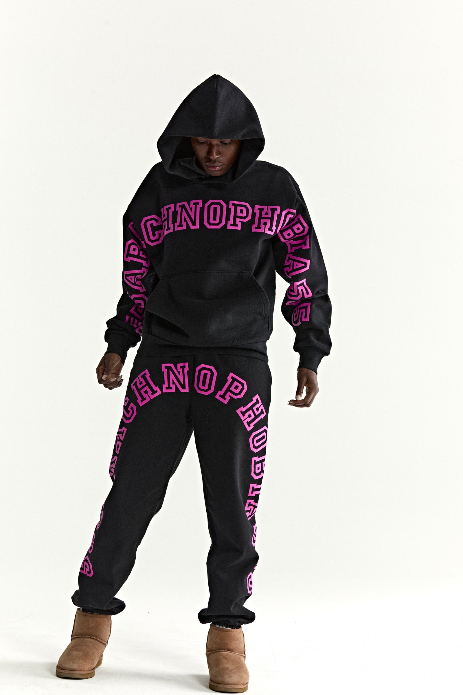 Black 13oz cotton fleece ARACH HOODIE and sweatpants with pink puff print text.