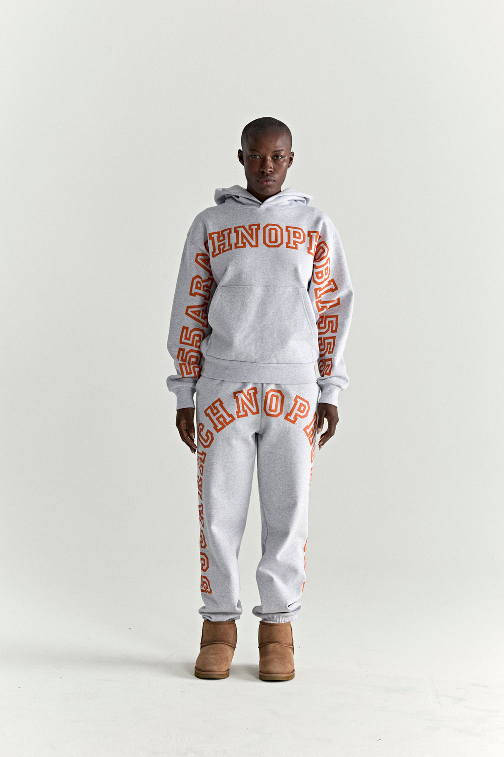 ARACH HOODIE and sweatpants set in grey 13oz cotton fleece with orange puff print text.