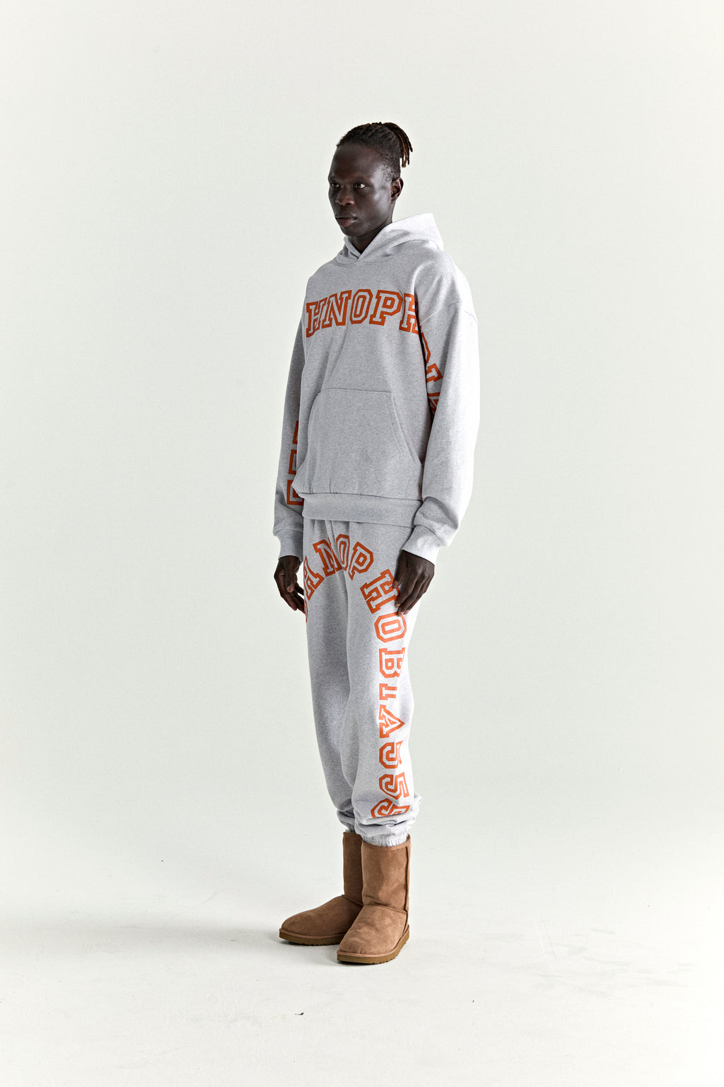 ARACH Hoodie & sweatpants in grey 13oz cotton fleece with orange puff/discharge text print.