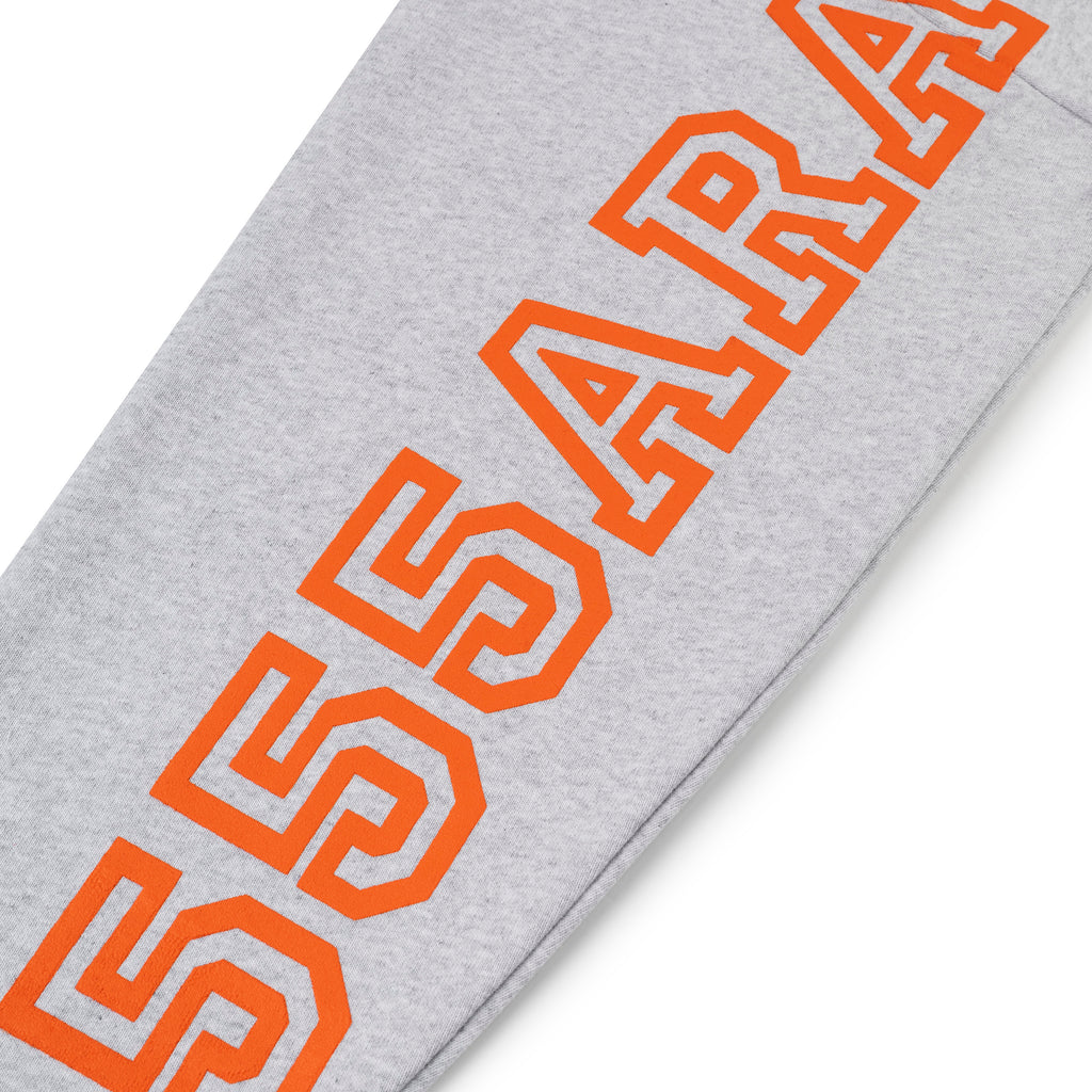 Light grey 13oz cotton fleece hoodie sleeve with bold orange puff print text.