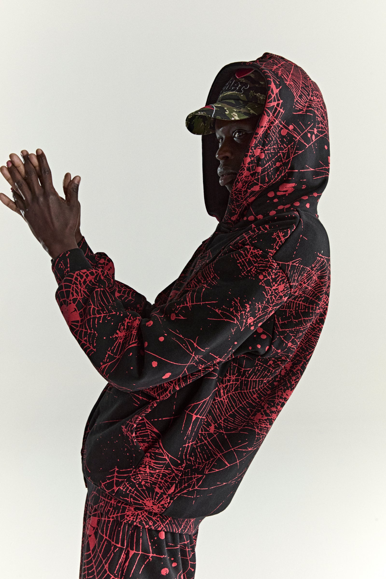 BLACK AOP WEB ZIP UP V2 HOODIE ON MODEL