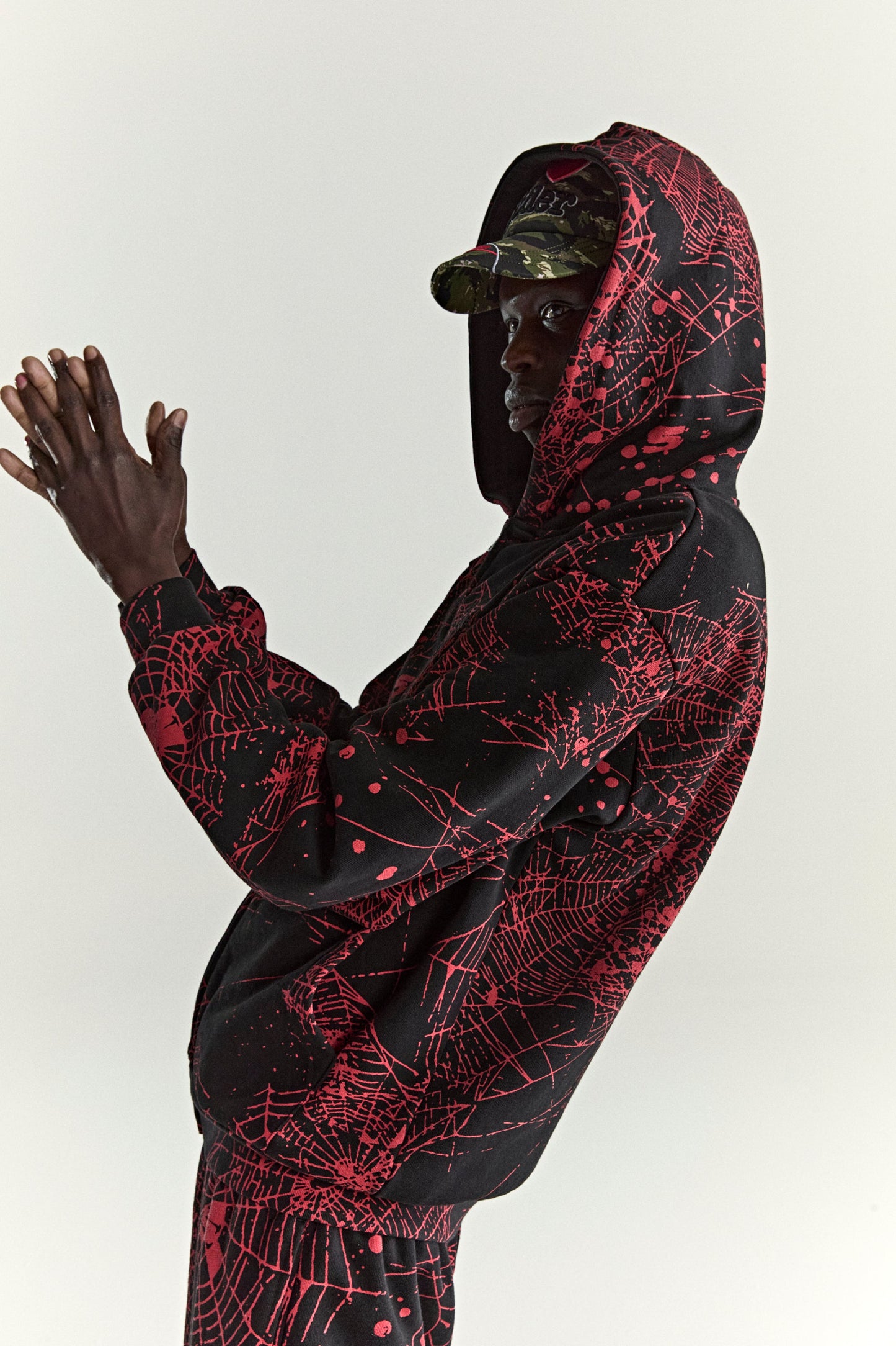 BLACK AOP WEB ZIP UP V2 HOODIE ON MODEL