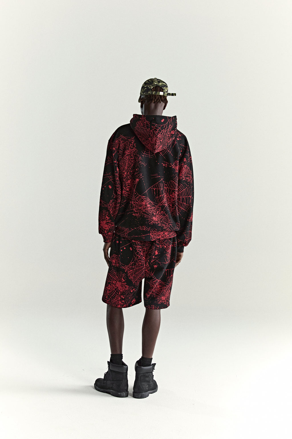 BLACK AOP WEB ZIP UP V2 HOODIE ON MODEL