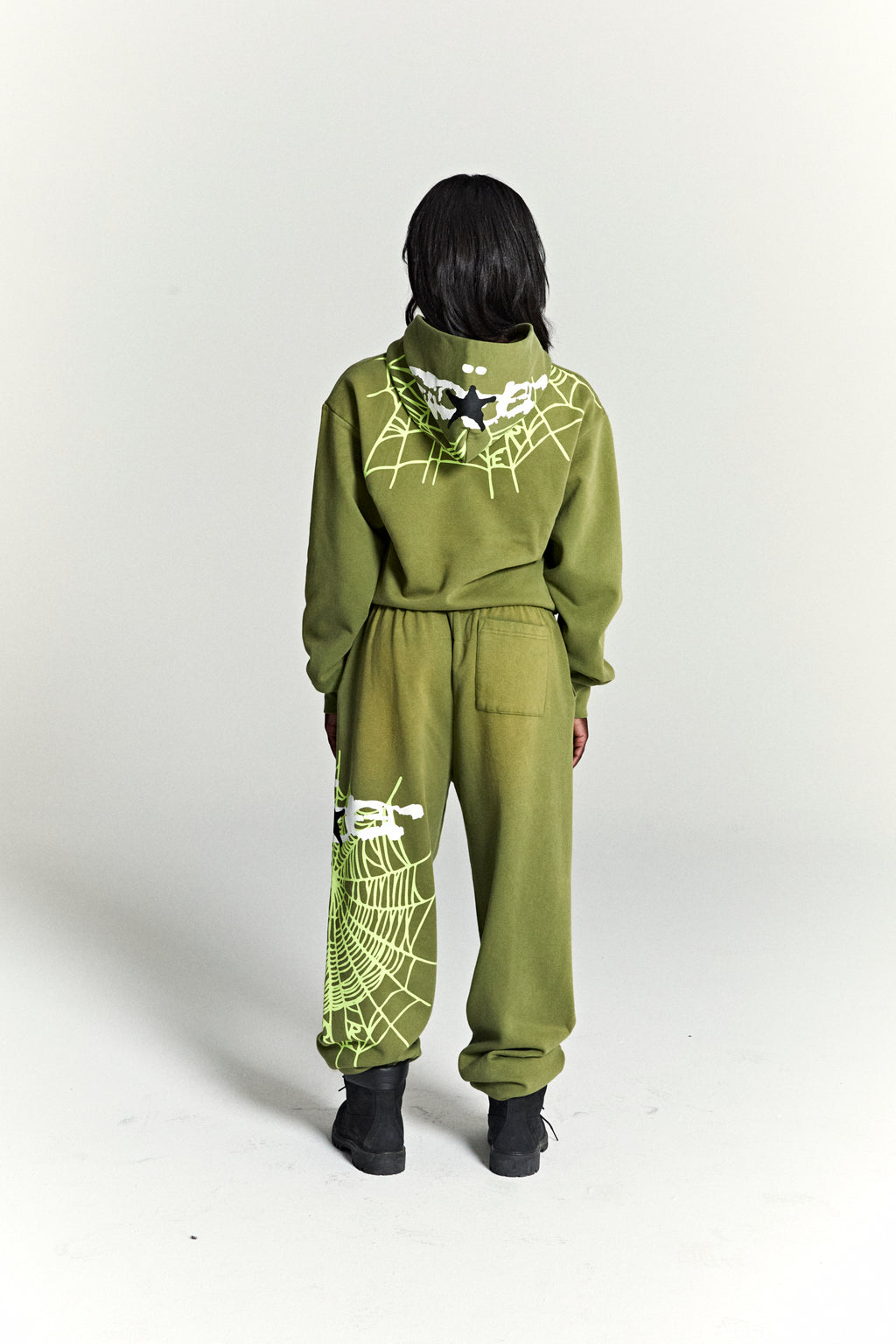 Olive green heavy web hoodie and sweatpants with neon green spider web and star puff prints.