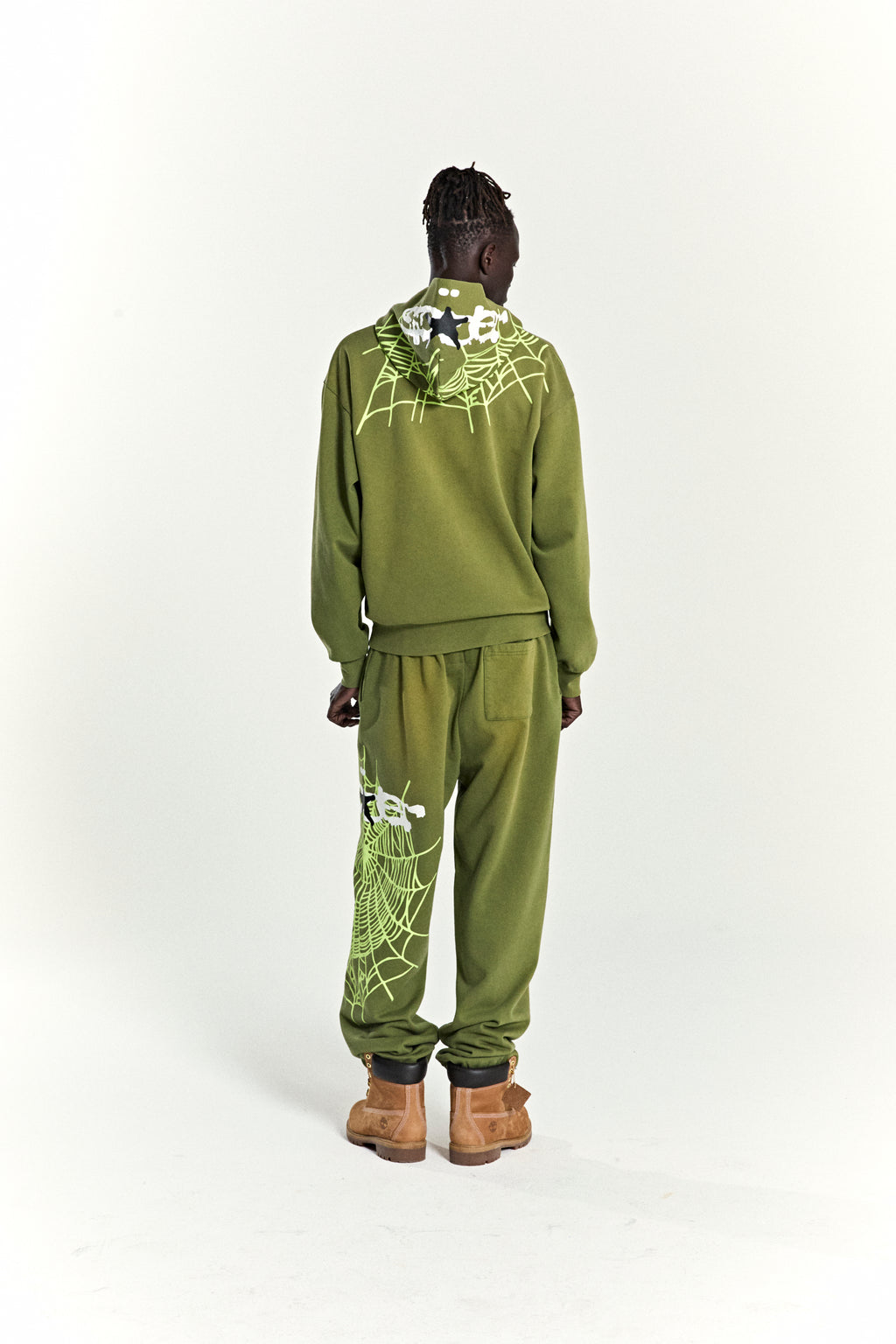 Olive green heavy web hoodie and sweatpants with star and web puff prints.