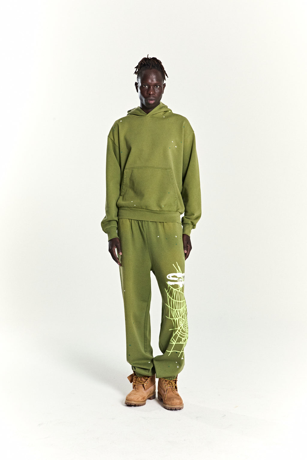 Olive green heavy web hoodie and sweatpants with scattered star and web prints.