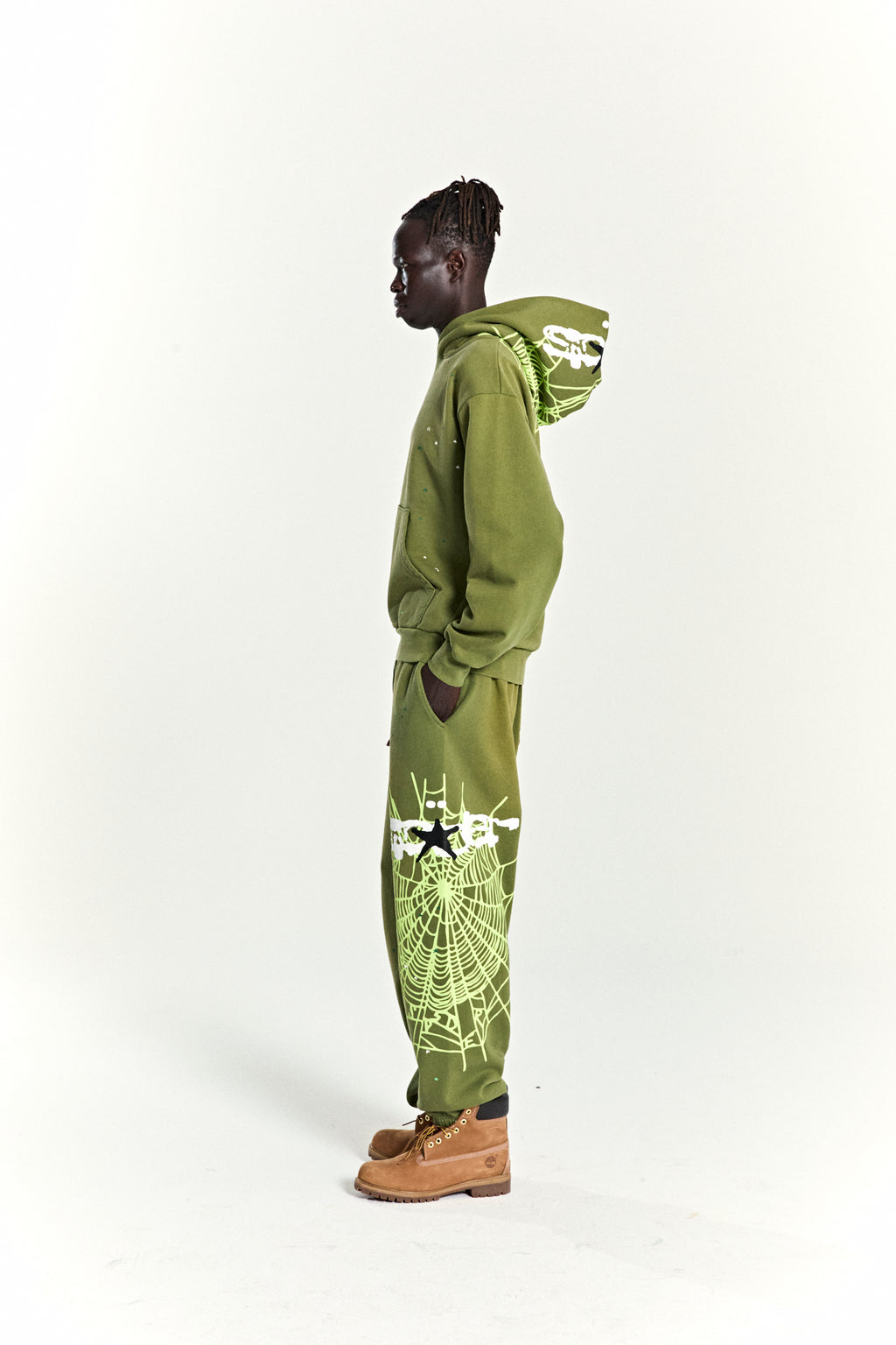 Olive green heavy web hoodie and sweatpants with neon green spiderweb and star puff prints.