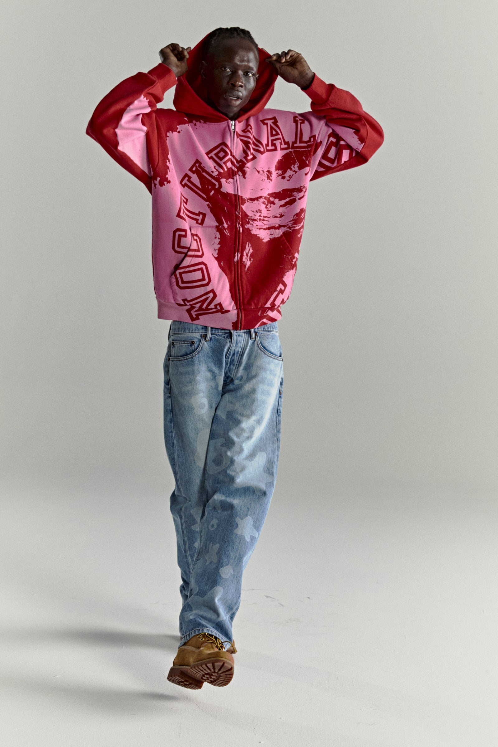 NOCTURNAL ZIP HOODIE: Color-blocked red and pink 13oz cotton fleece hoodie with varsity lettering.